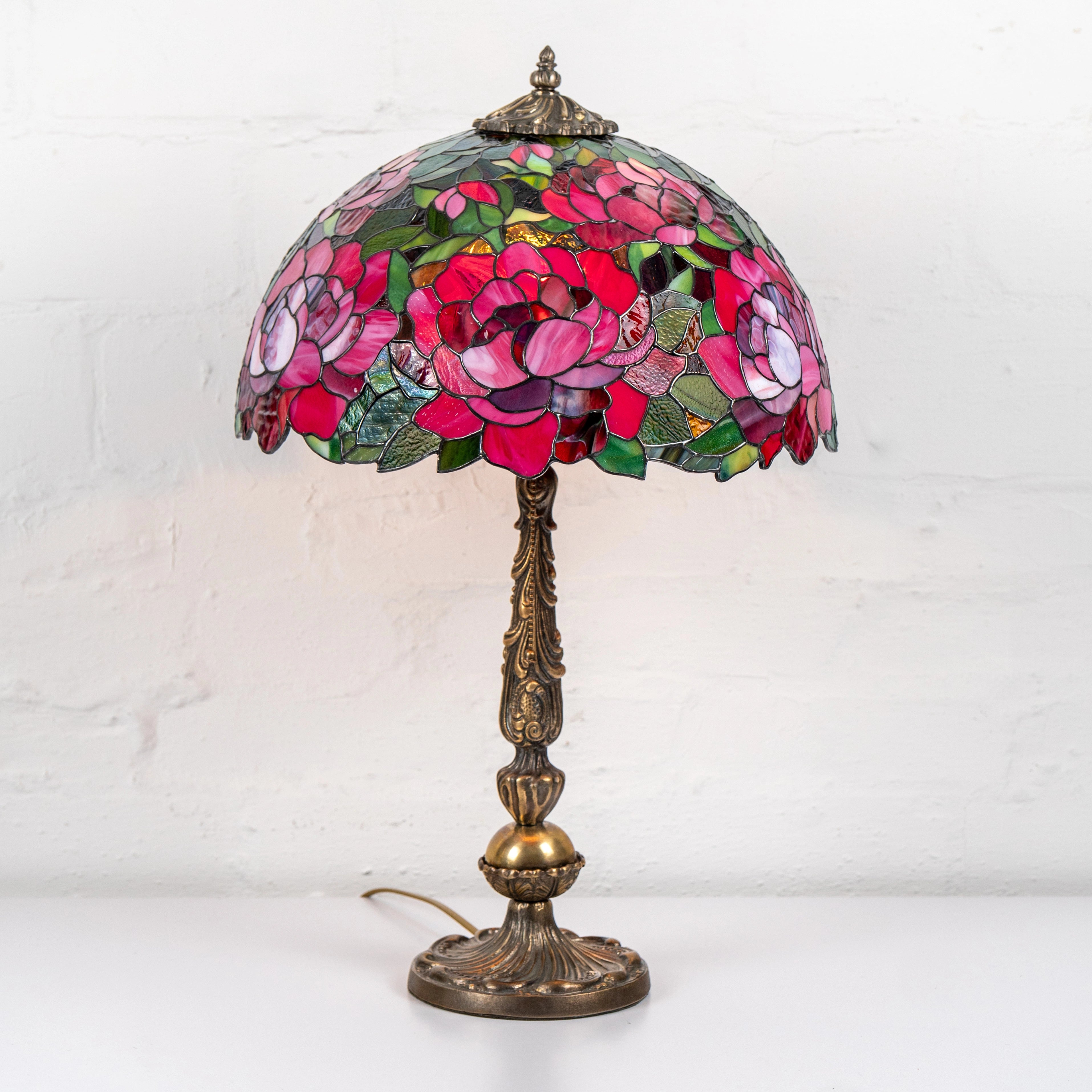 Stained glass lamp with peony design on a white background