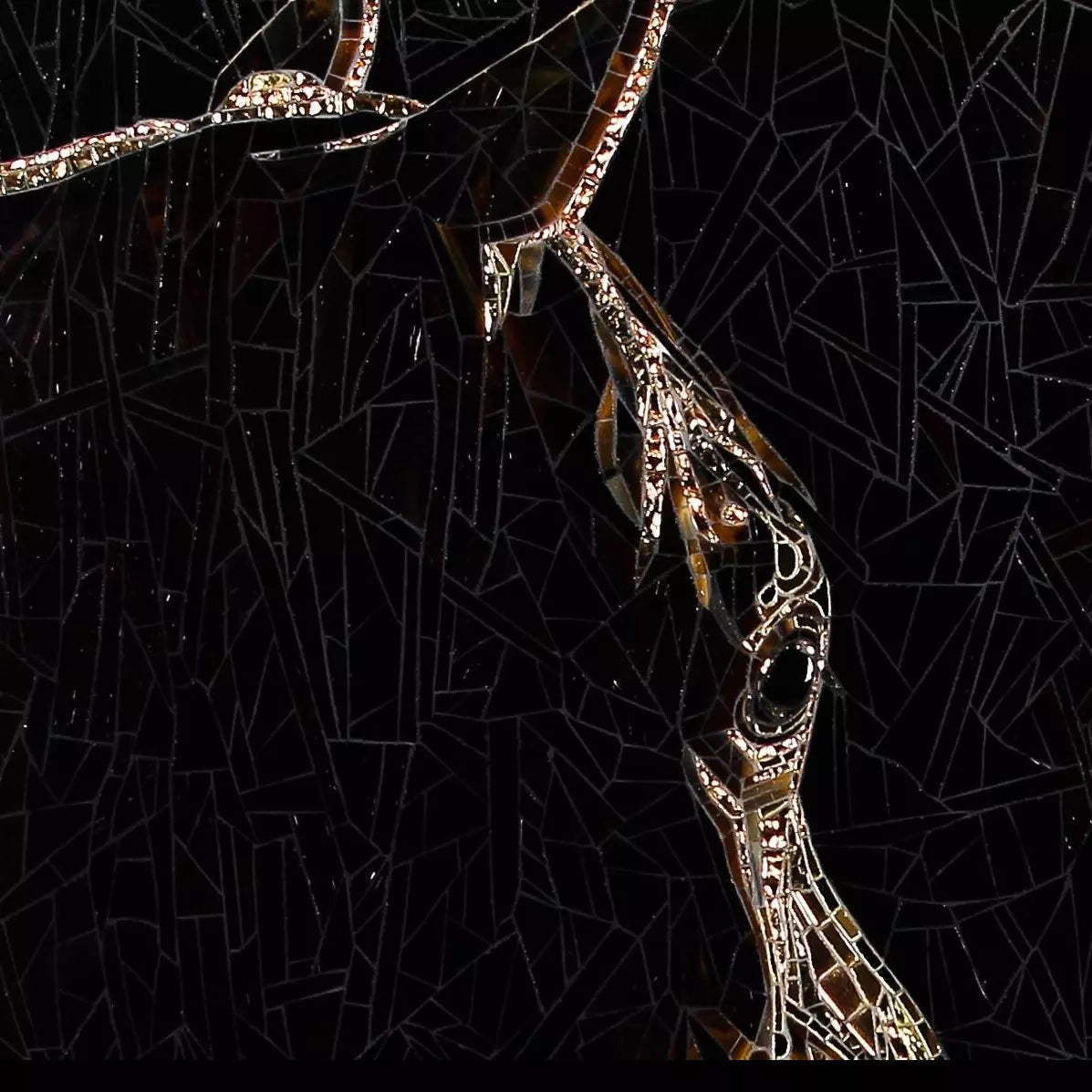 Close-up of stained glass mosaic showing horse head in golden and amber glass on black background