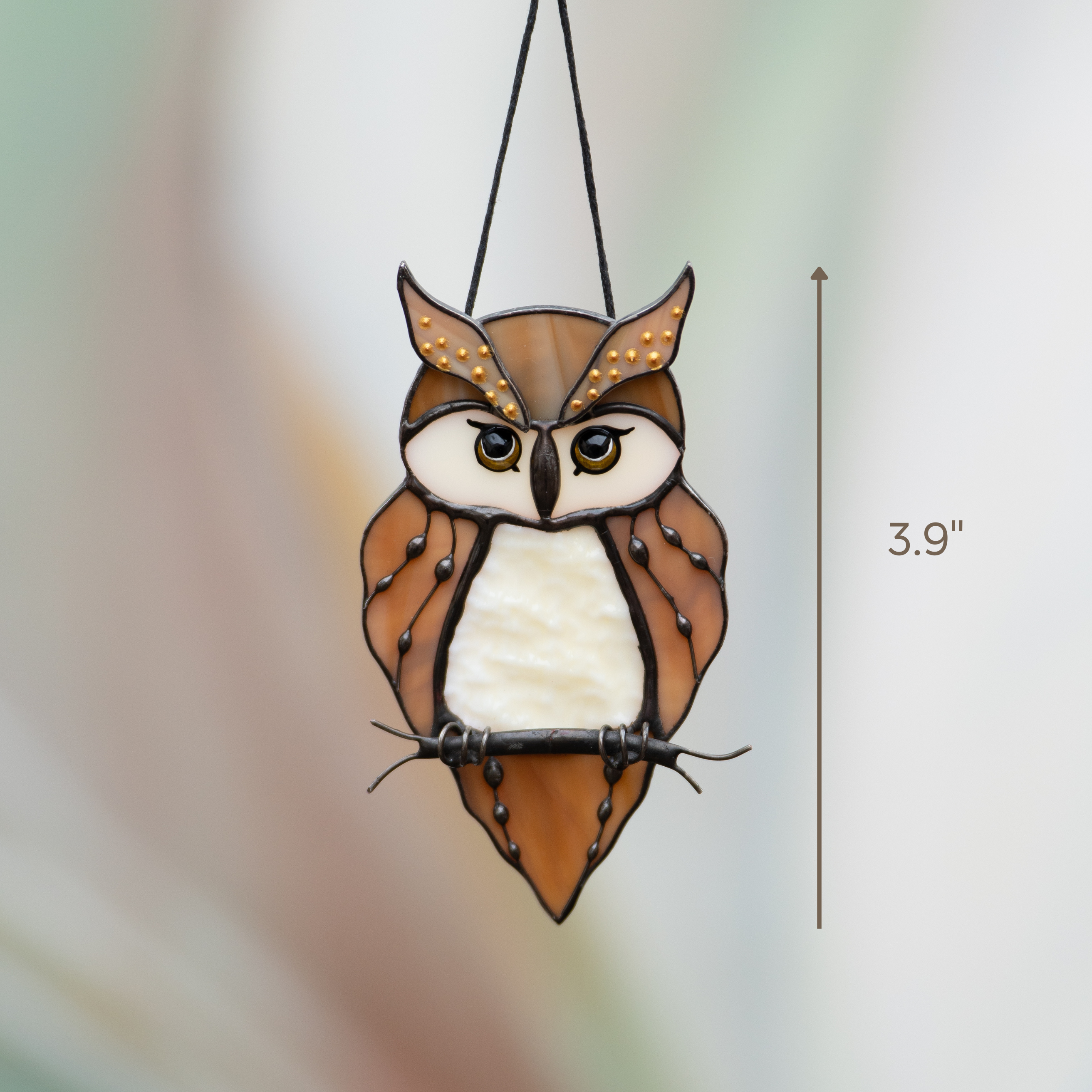 Stained glass owl with bright eyes and warm feathers, hanging from black cord, sized 3.9 inches