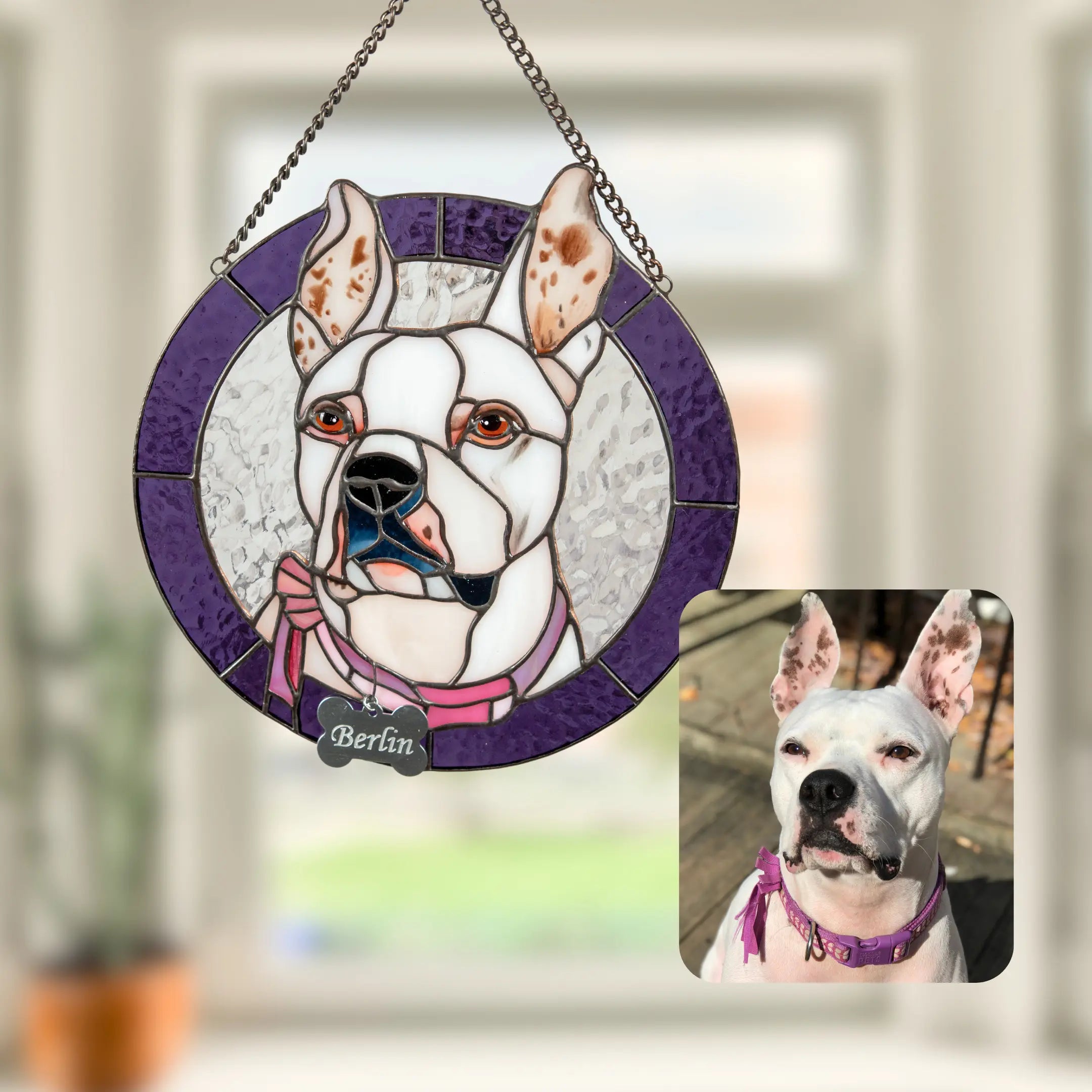 Stained glass pet portrait of a white dog with a purple frame, displayed in living room interior.