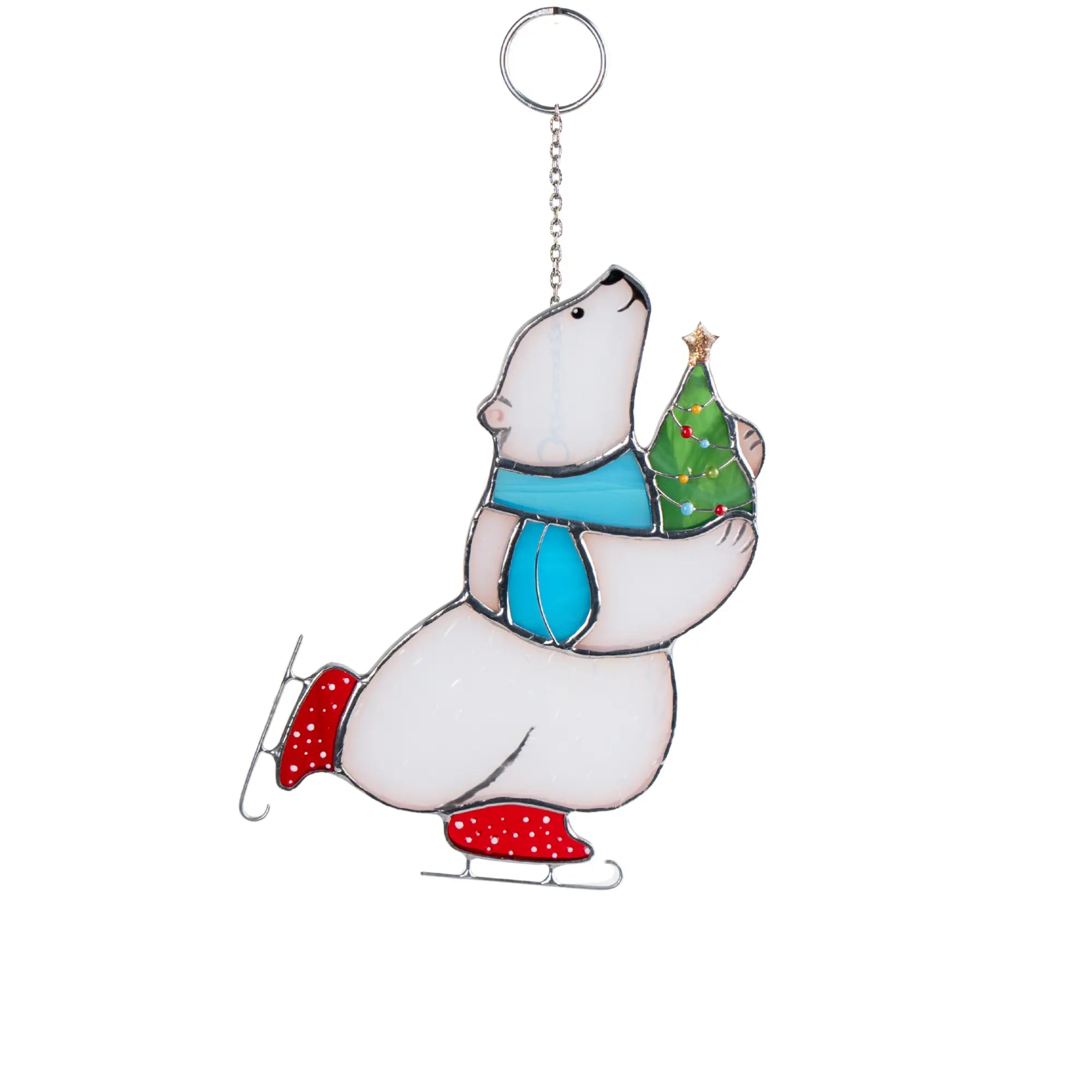 Stained glass suncatcher featuring a polar bear with a Christmas tree on a white background