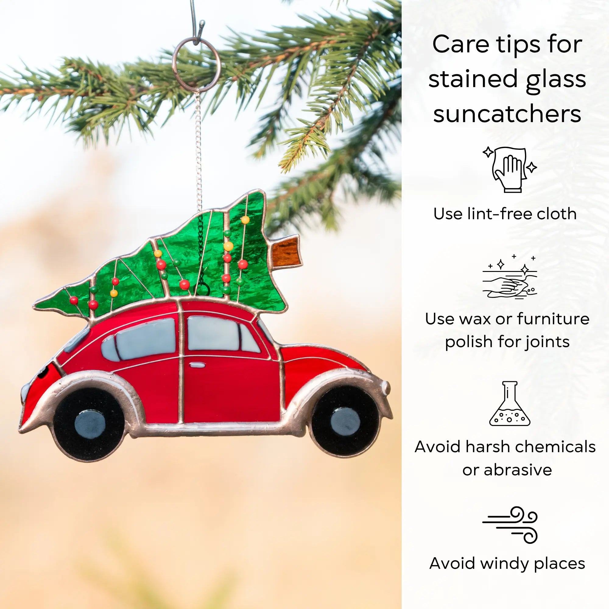 Stained glass suncatcher of a red car with a Christmas tree on top, hanging from a tree branch with care tips: use lint-free cloth, polish joints with car wax or furniture polish, avoid harsh chemicals, and windy places.