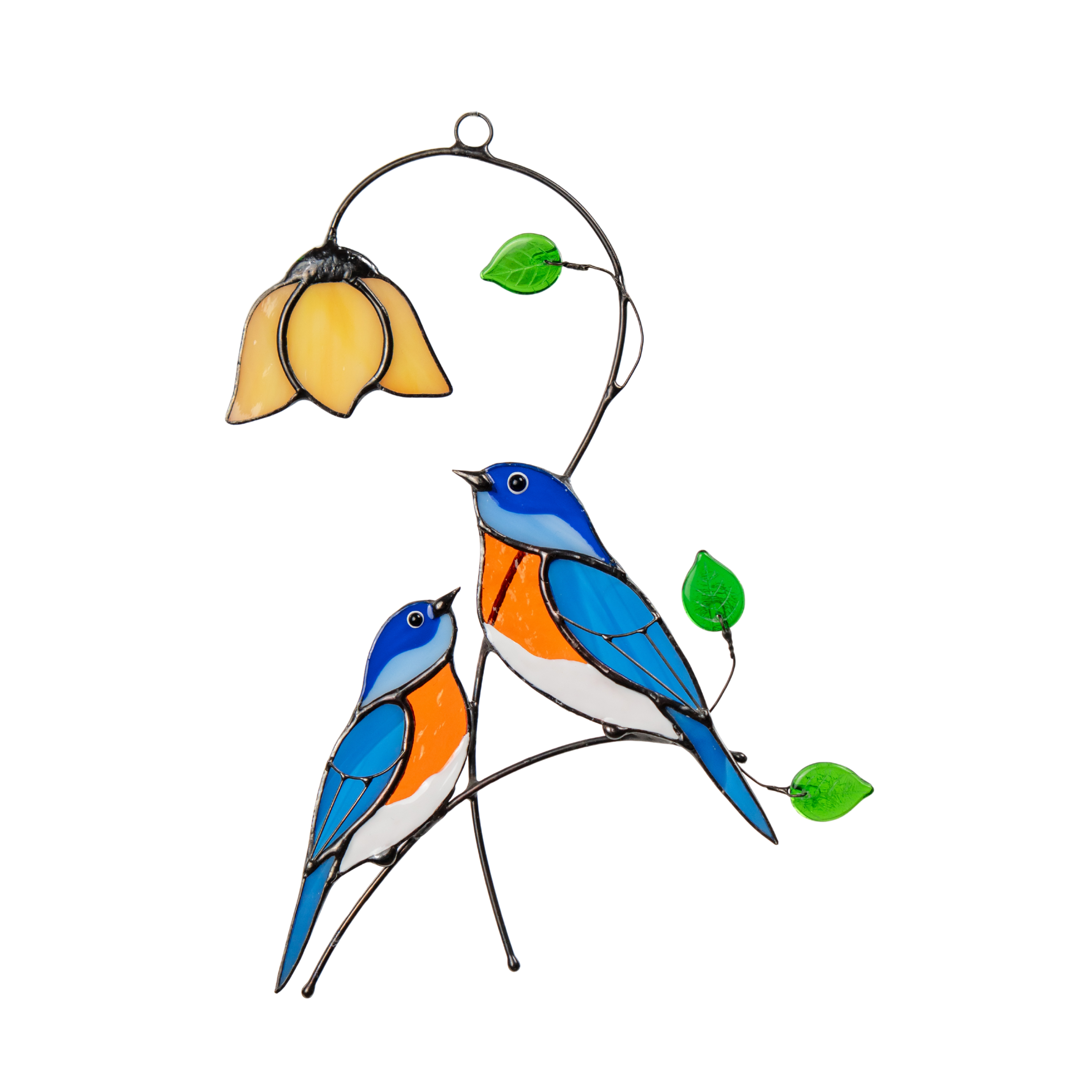 Two stained glass bluebirds sit under a yellow flower with green leaves, hanging as a window decoration