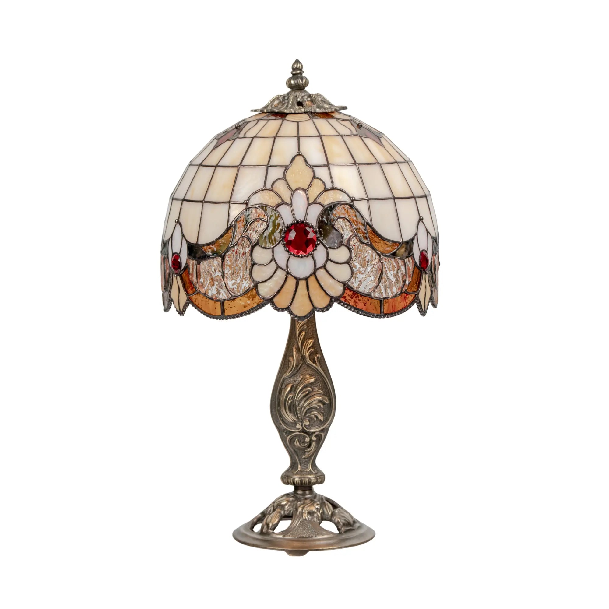 Decorative stained glass table lamp with red details and beige patterns on a white background
