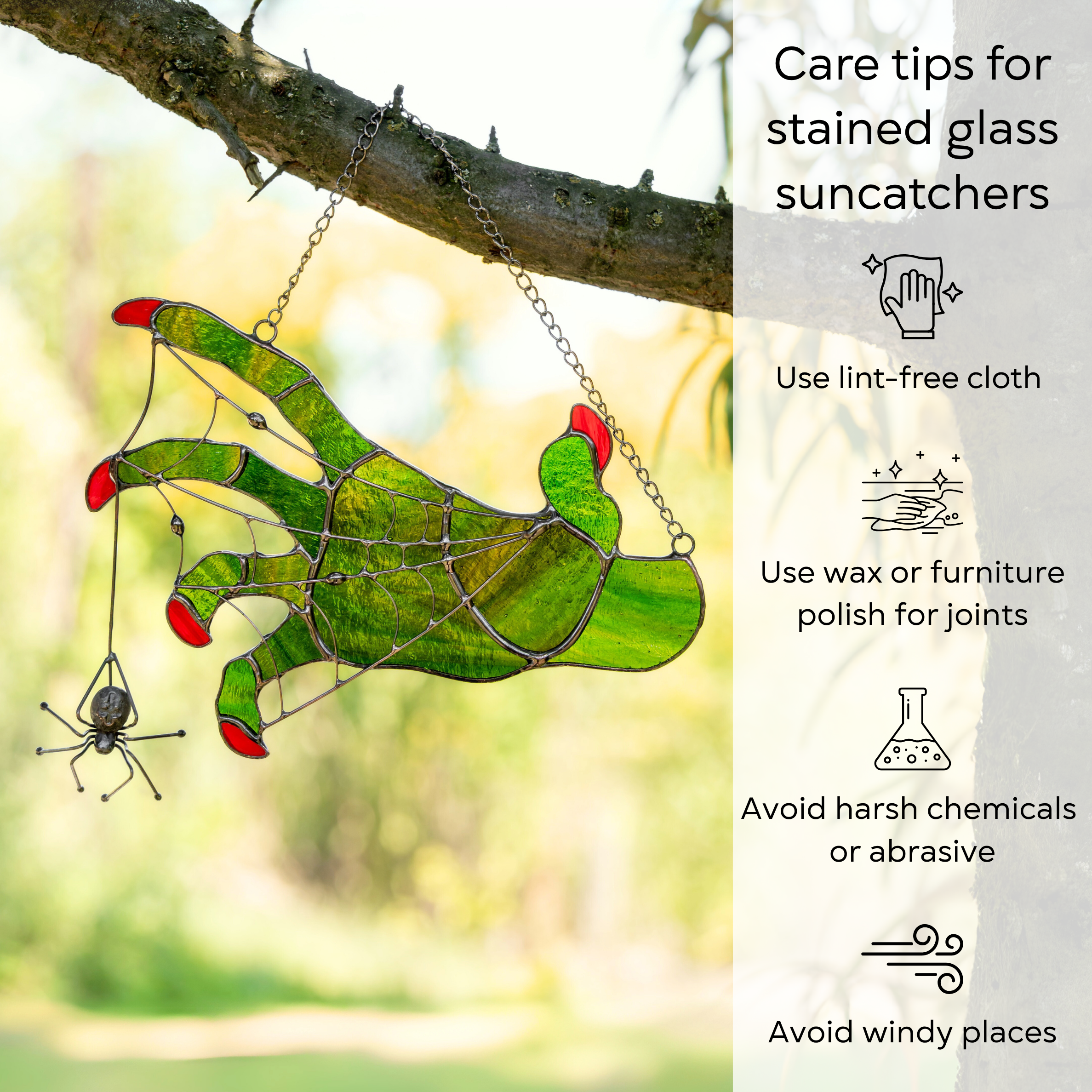 Glass witch hand with spider hanging from a tree, surrounded by greenery with care tips beside: use lint-free cloth, polish joints with car wax or furniture polish, avoid harsh chemicals, and windy places.