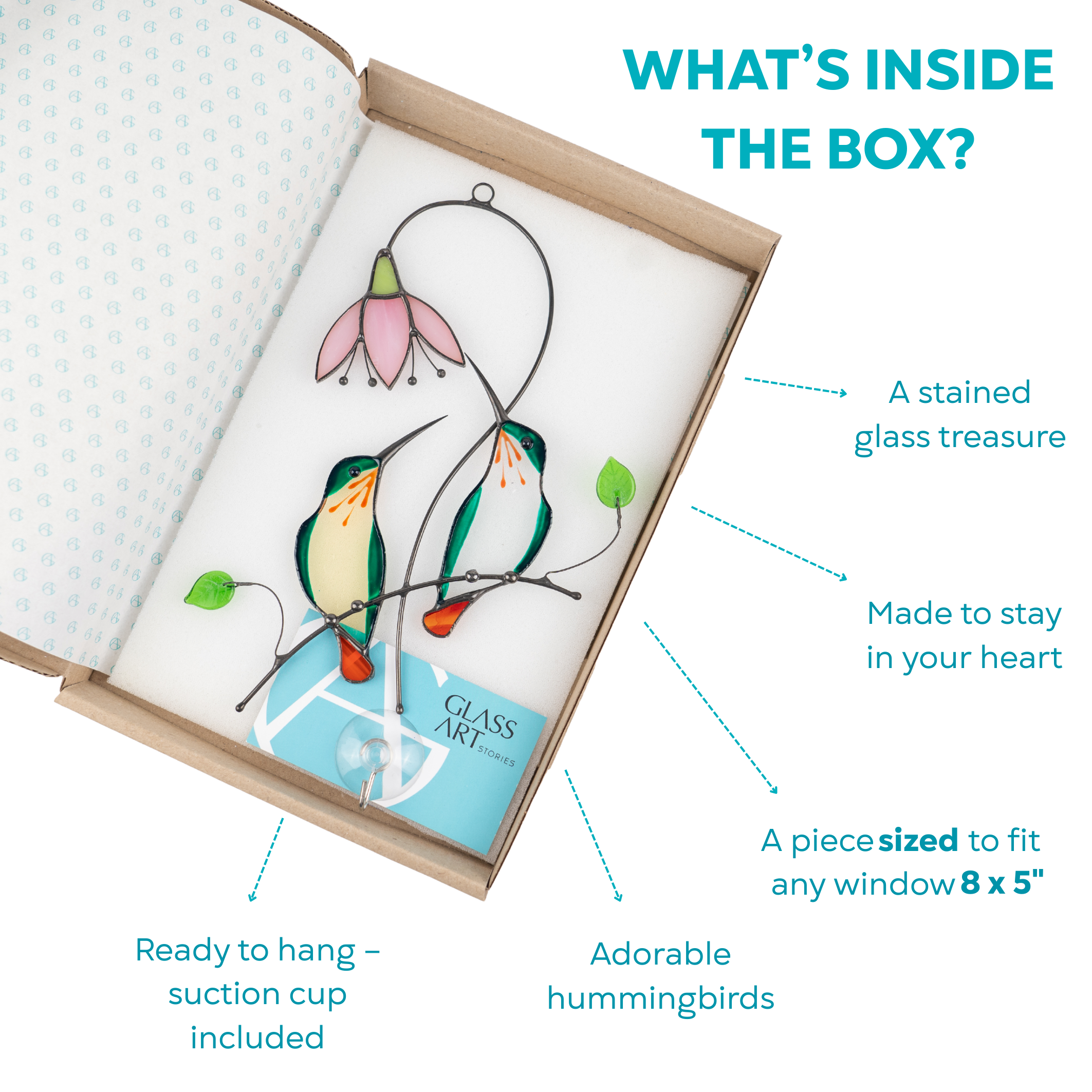 Open gift box with stained glass green hummingbirds, suction cup, and branding card inside.