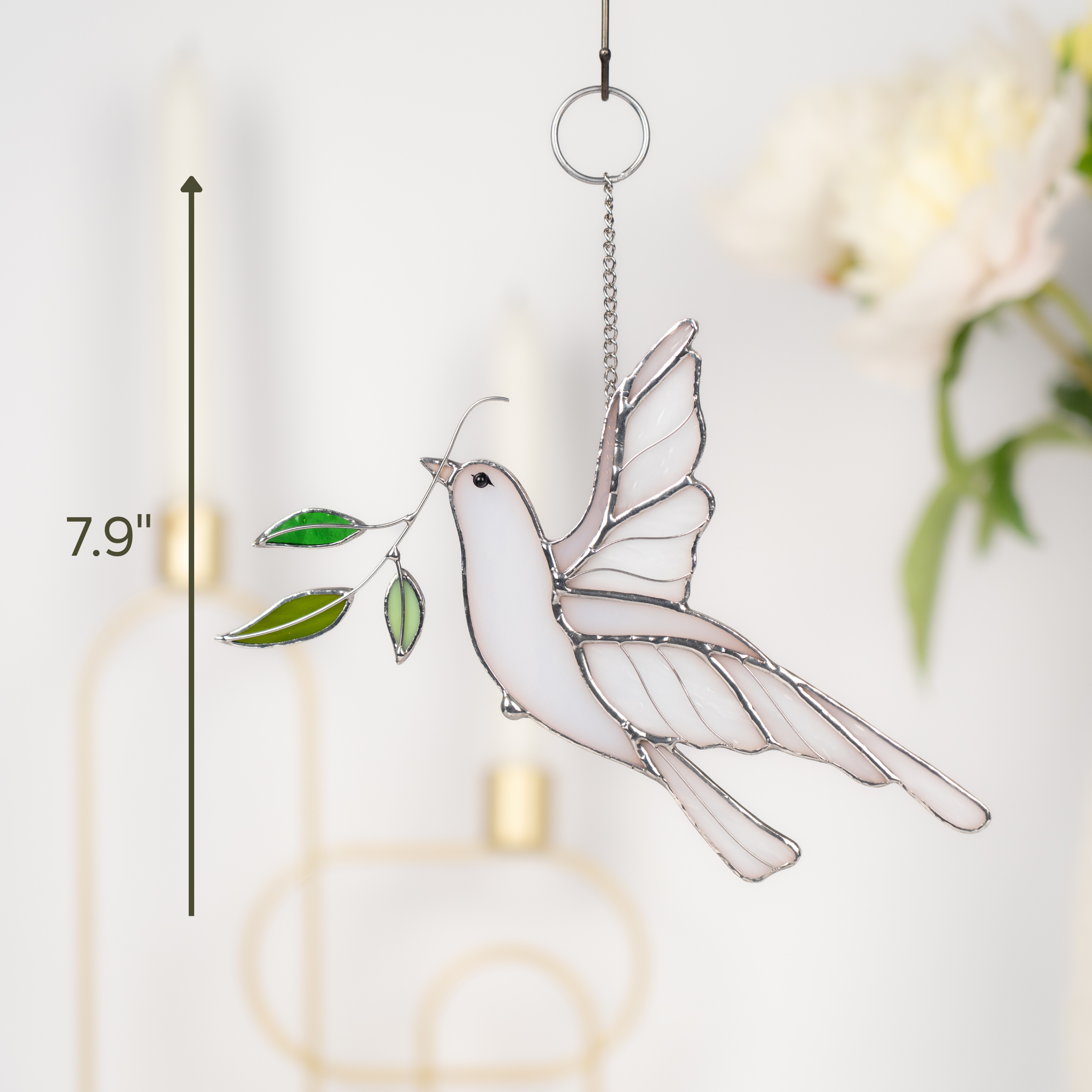 Dove stained glass piece hanging in bright space with vertical measurement showing 7.9 inches tall.