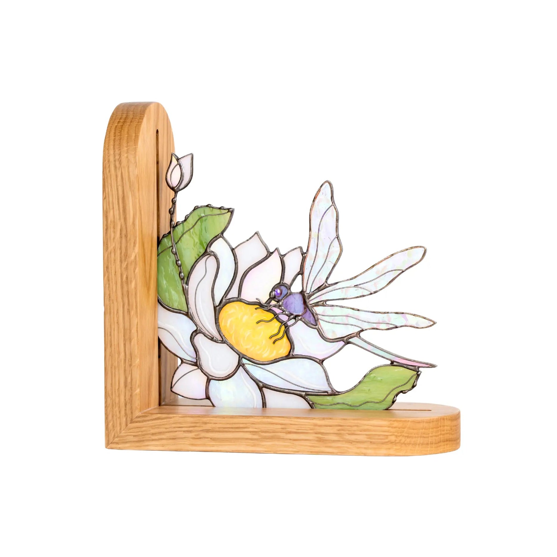 Stained glass bookend with dragonfly and flower on a white background