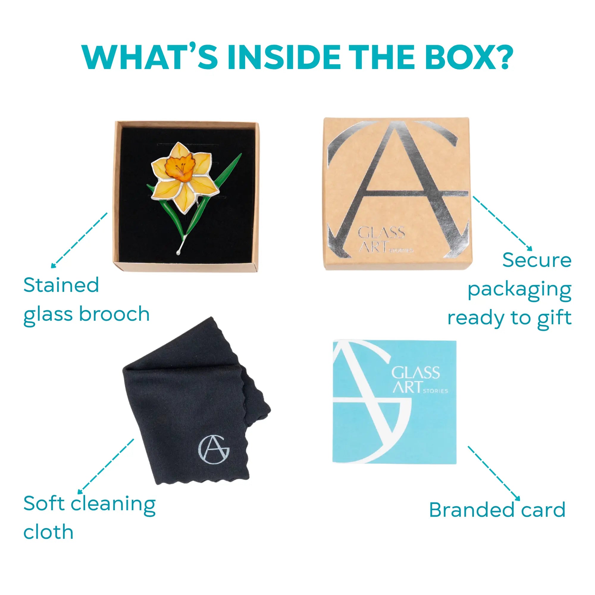 Flat lay of a yellow daffodil stained glass brooch in its gift box, with a cleaning cloth, brand card, and box cover.