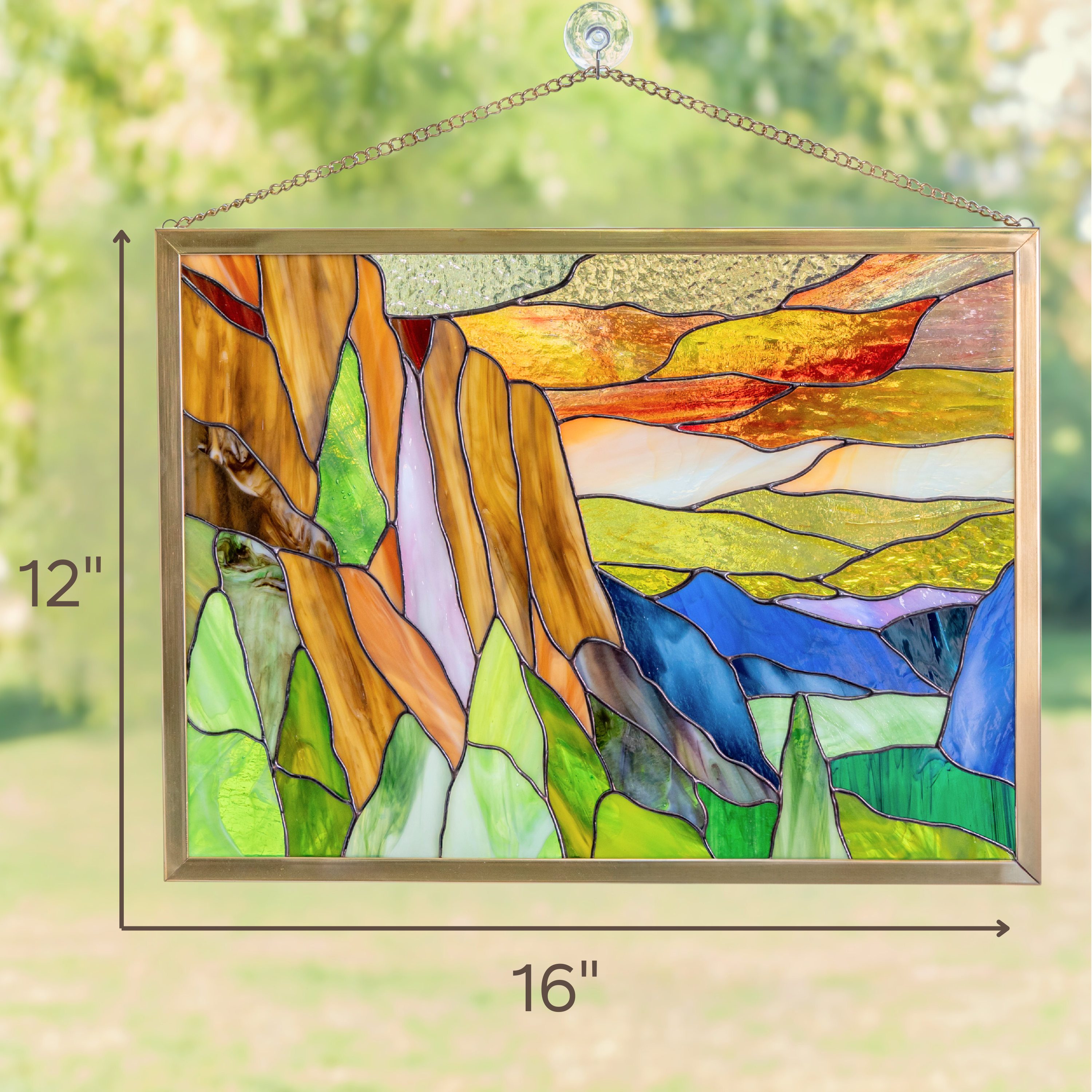 Window-hanging stained glass panel Yosemite with visible dimensions: 16 inches wide, 12 inches tall.