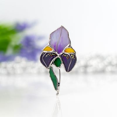 Stained glass pin of a purple iris