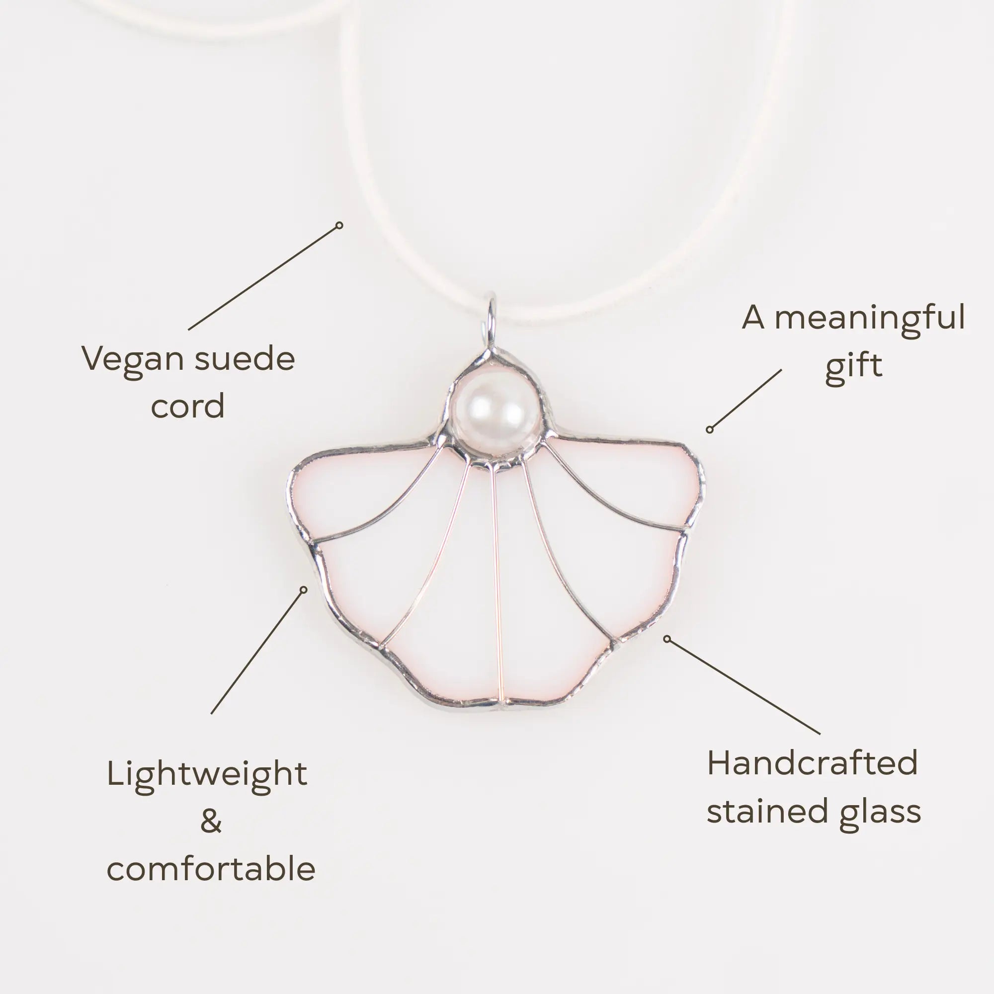 Lightweight handcrafted stained glass pendant with a pearl accent and vegan suede cord – a meaningful and stylish accessory gift.