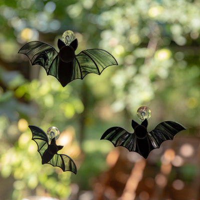 A set of three stained glass vampire bats Halloween suncatchers