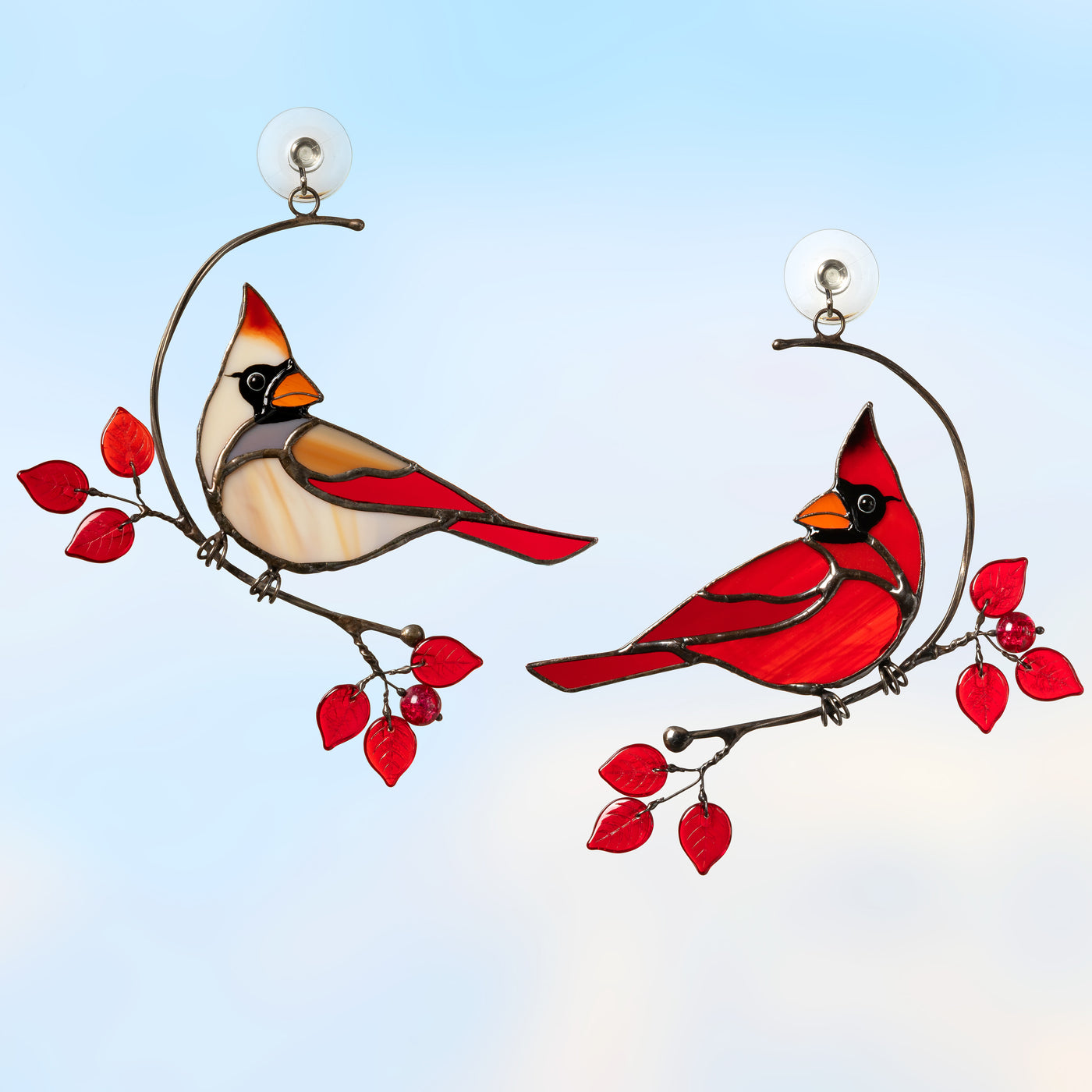 Stained glass male and female cardinals sitting on the two separate wire branches with red leaves suncatcher