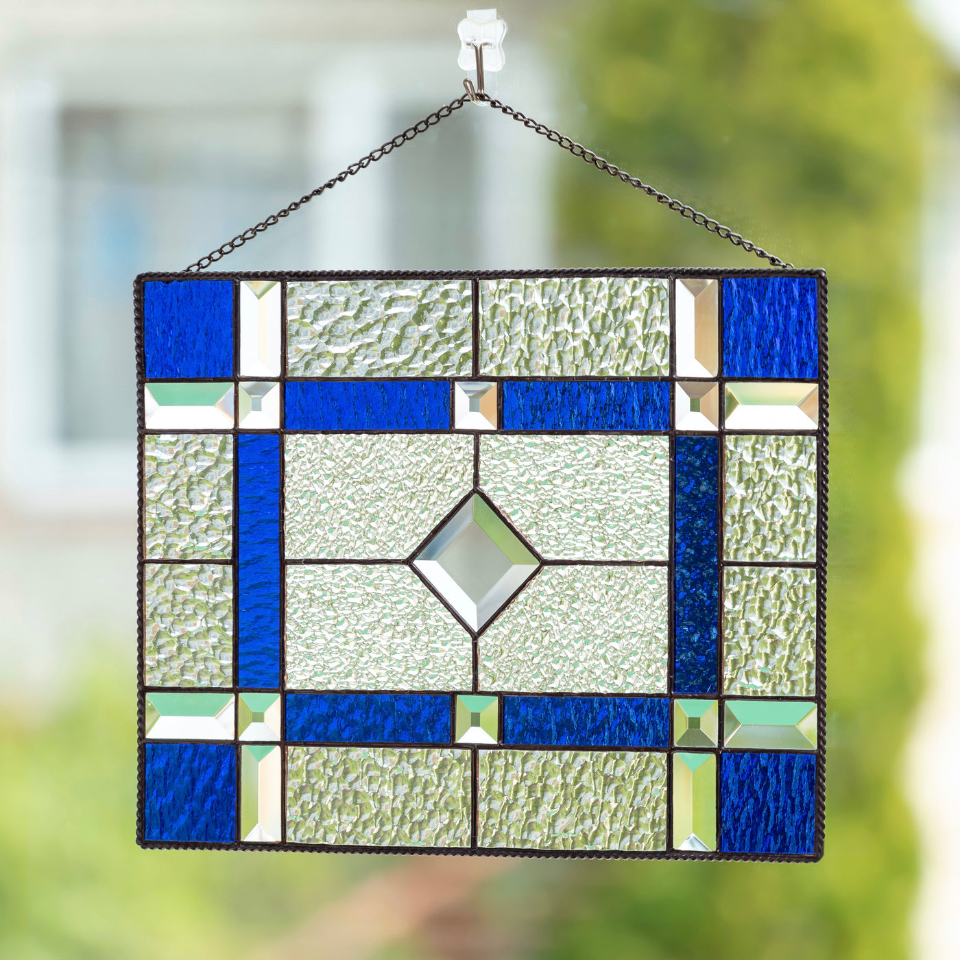 Stained glass clear and cobalt panel with beveled inserts for window