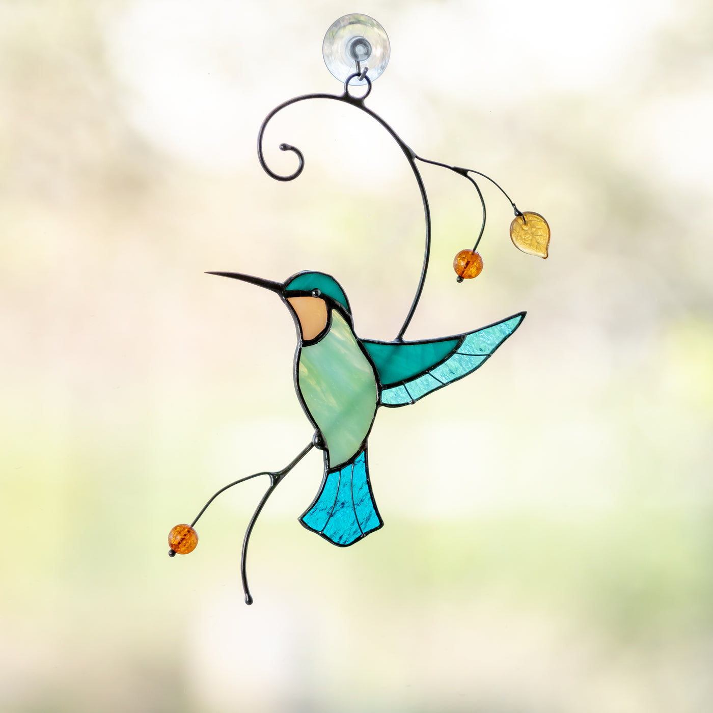 Stained glass hummingbird taking off the branch suncatcher
