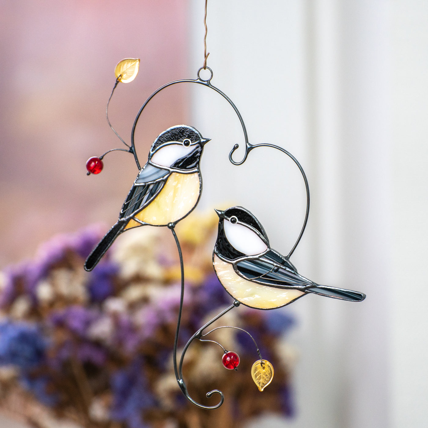 Stained glass couple of chickadees sitting on the branch in the shape of heart suncatcher