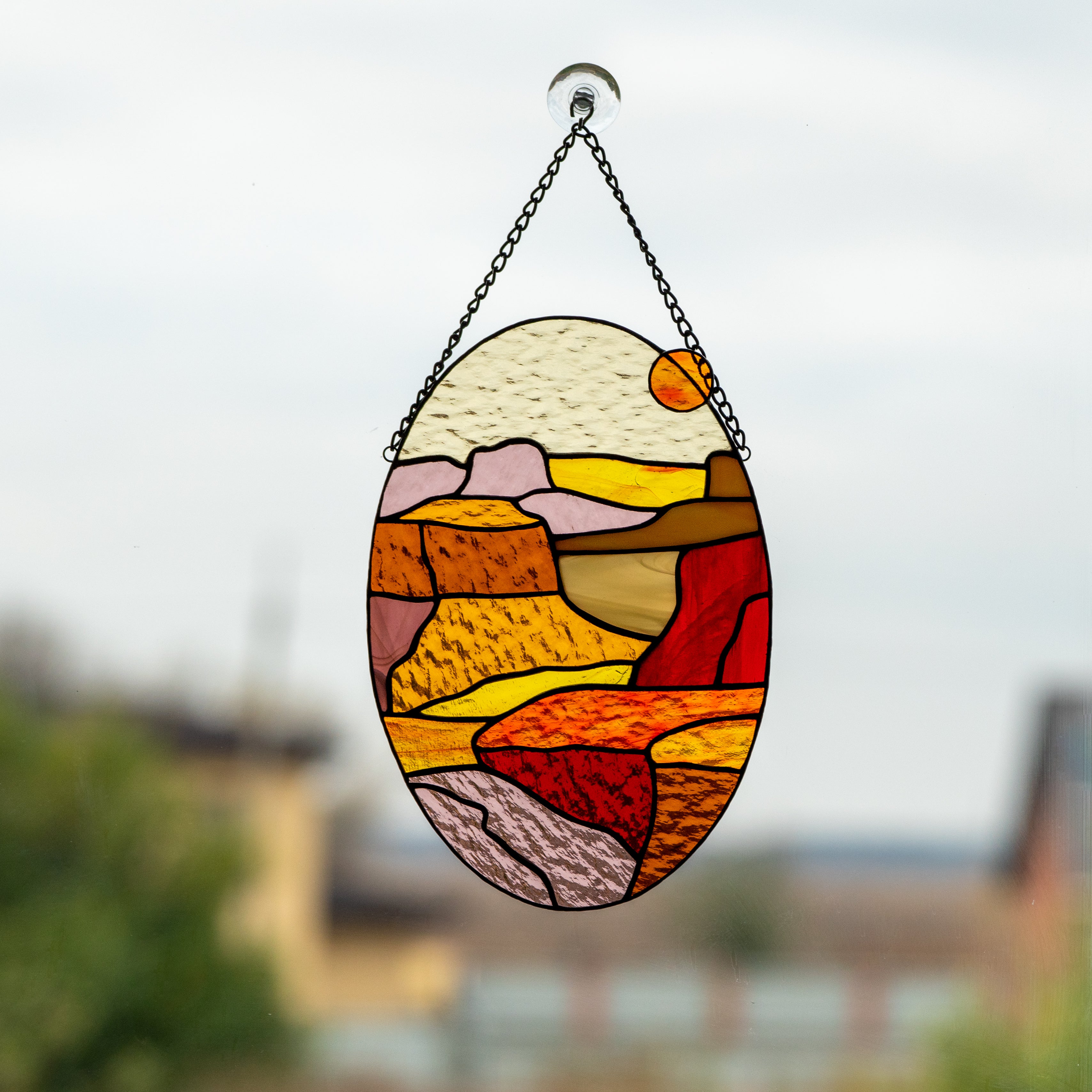 Stained glass oval panel depicting Arizona Grand Canyon