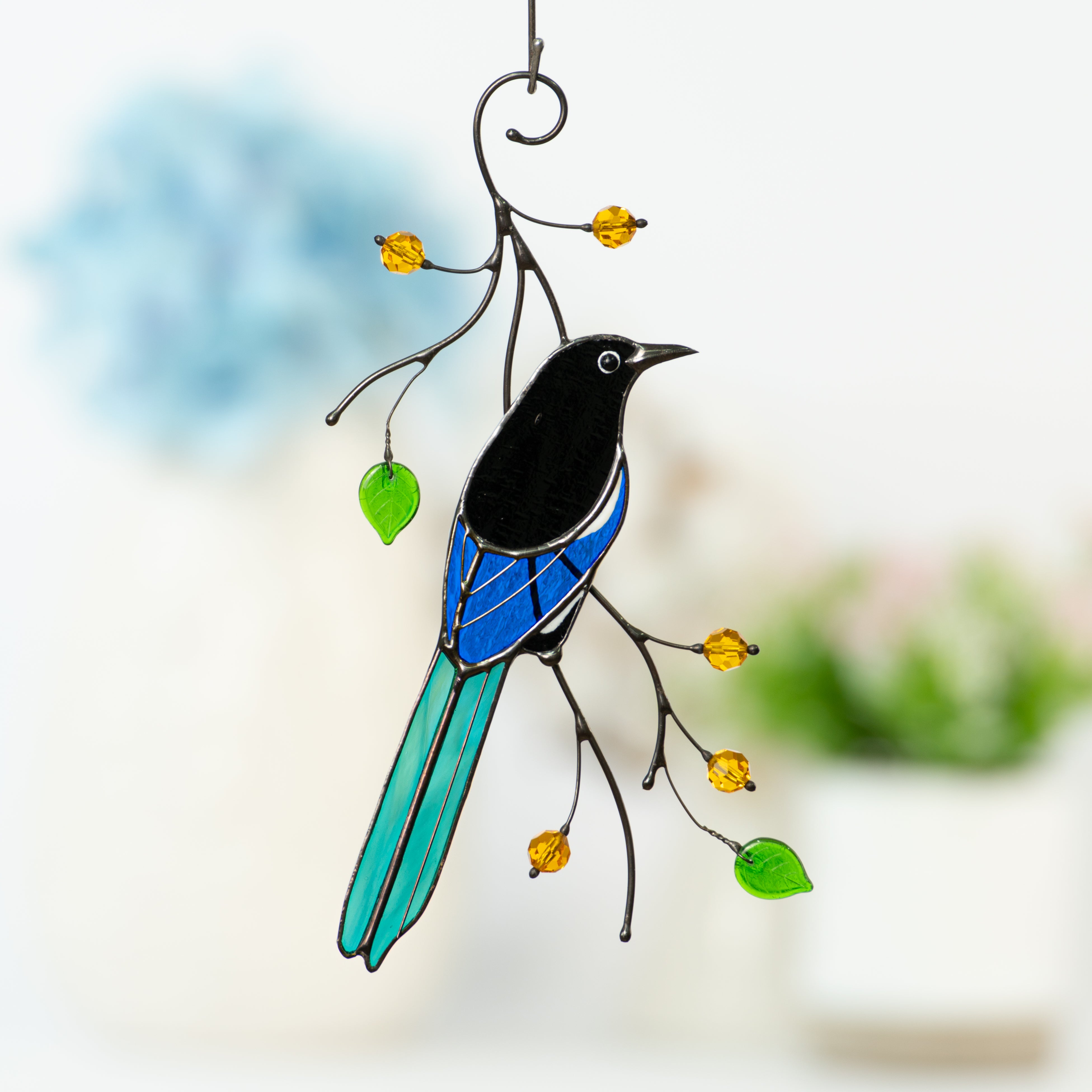 Stained glass magpie on the branch with leaves and berries window hanging
