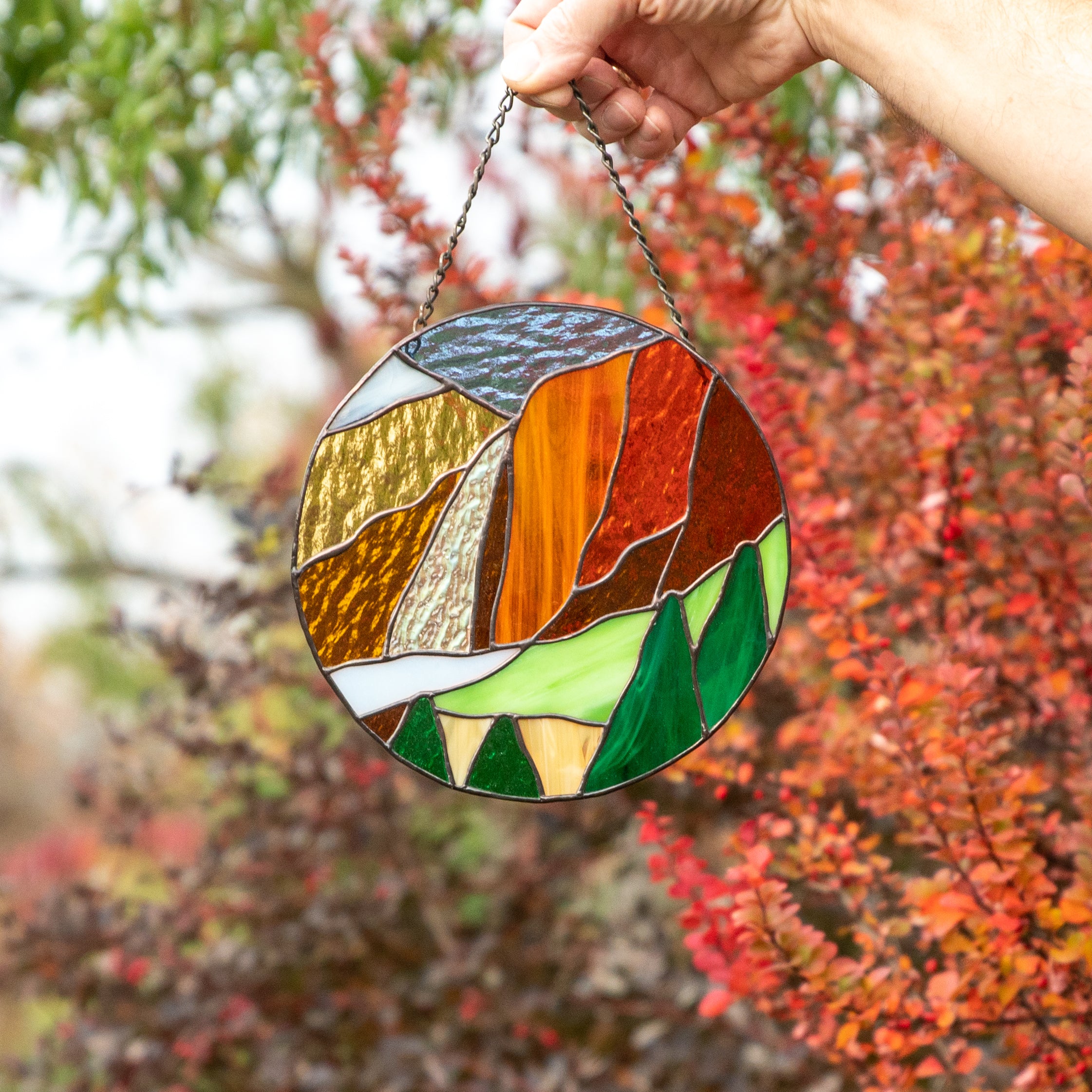 Stained glass round panel depicting Yosemite national park landscape