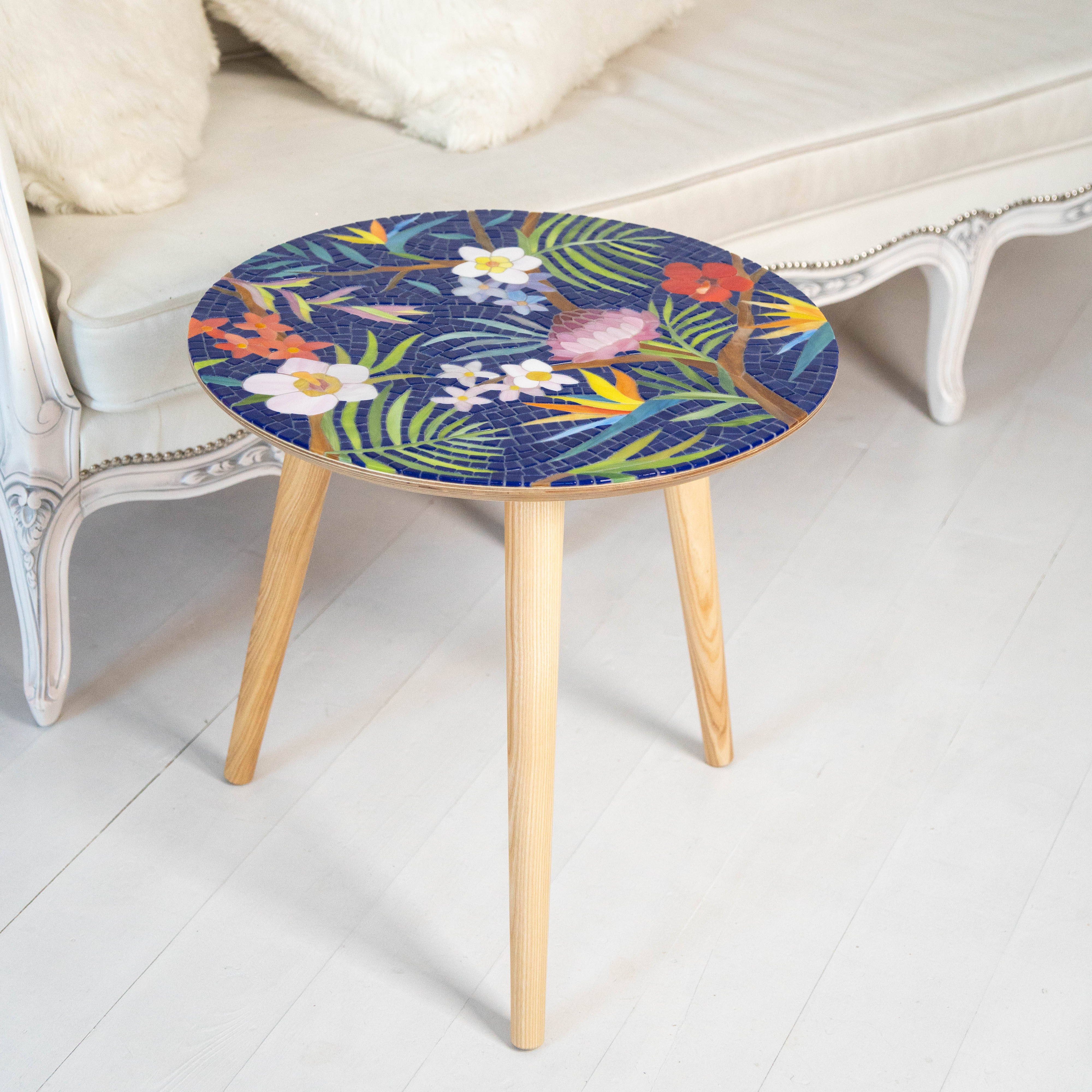 Stained glass round mosaic table depicting tropical plants