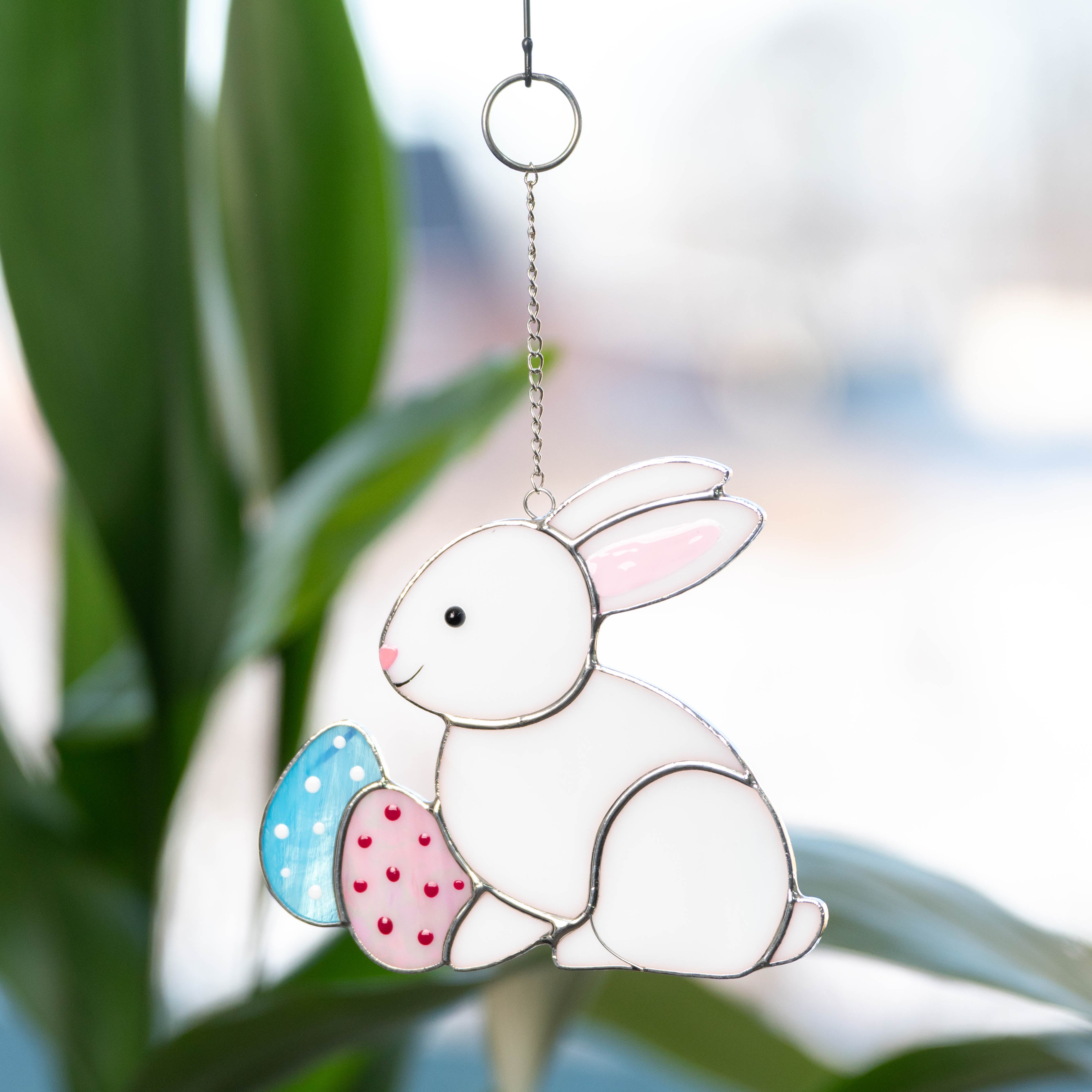 Stained glass suncatcher of Easter bunny with two eggs