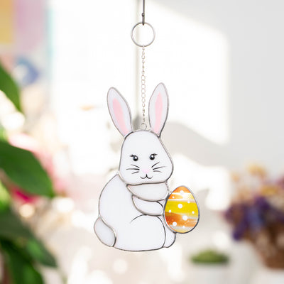 Stained glass Easter bunny with an orange egg suncatcher