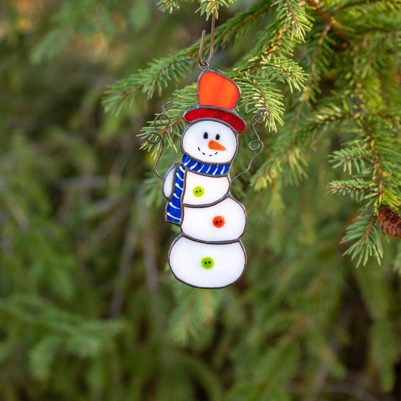 Stained glass snowman suncatcher as a New Year Tree decoration