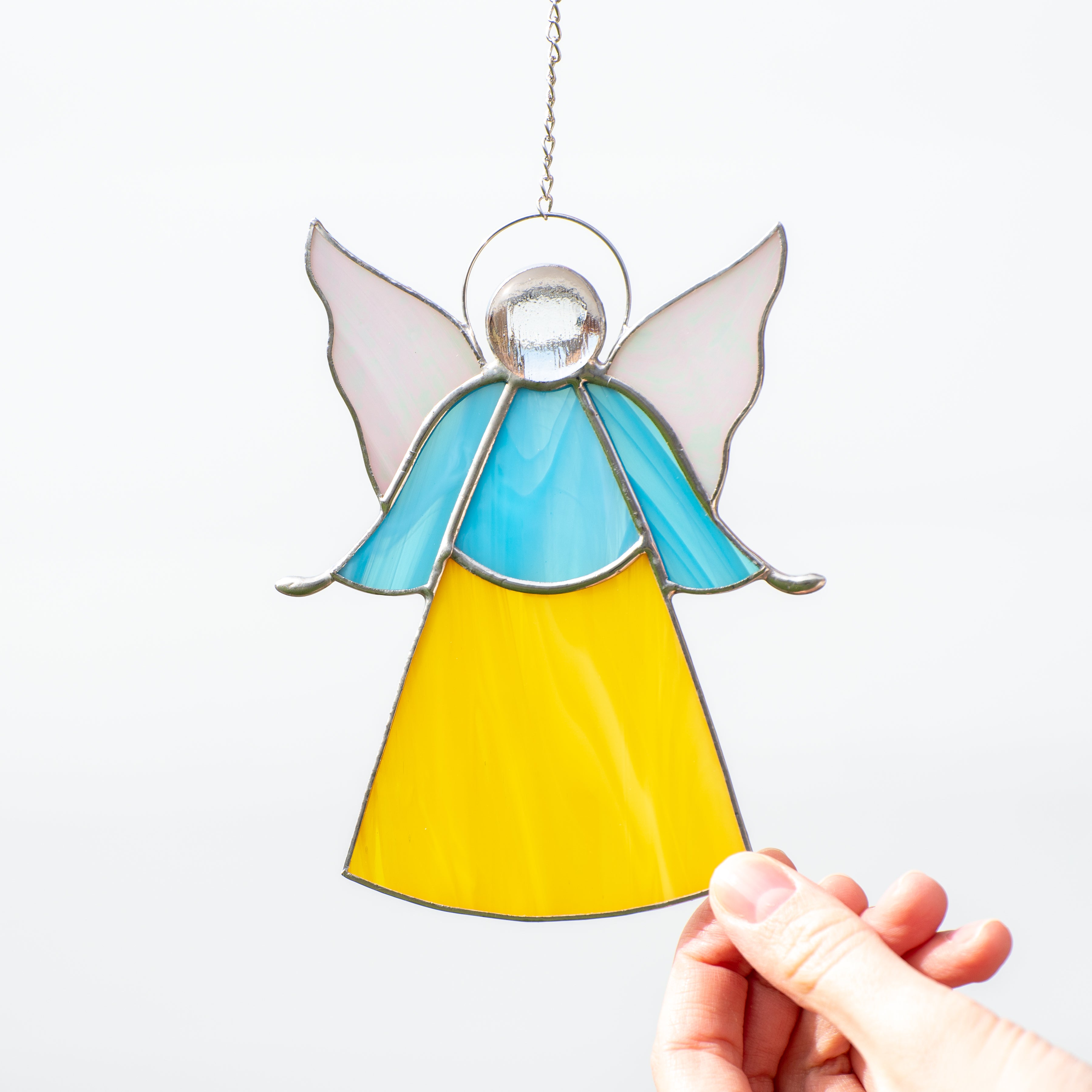Stained glass blue and yellow angel window hanging