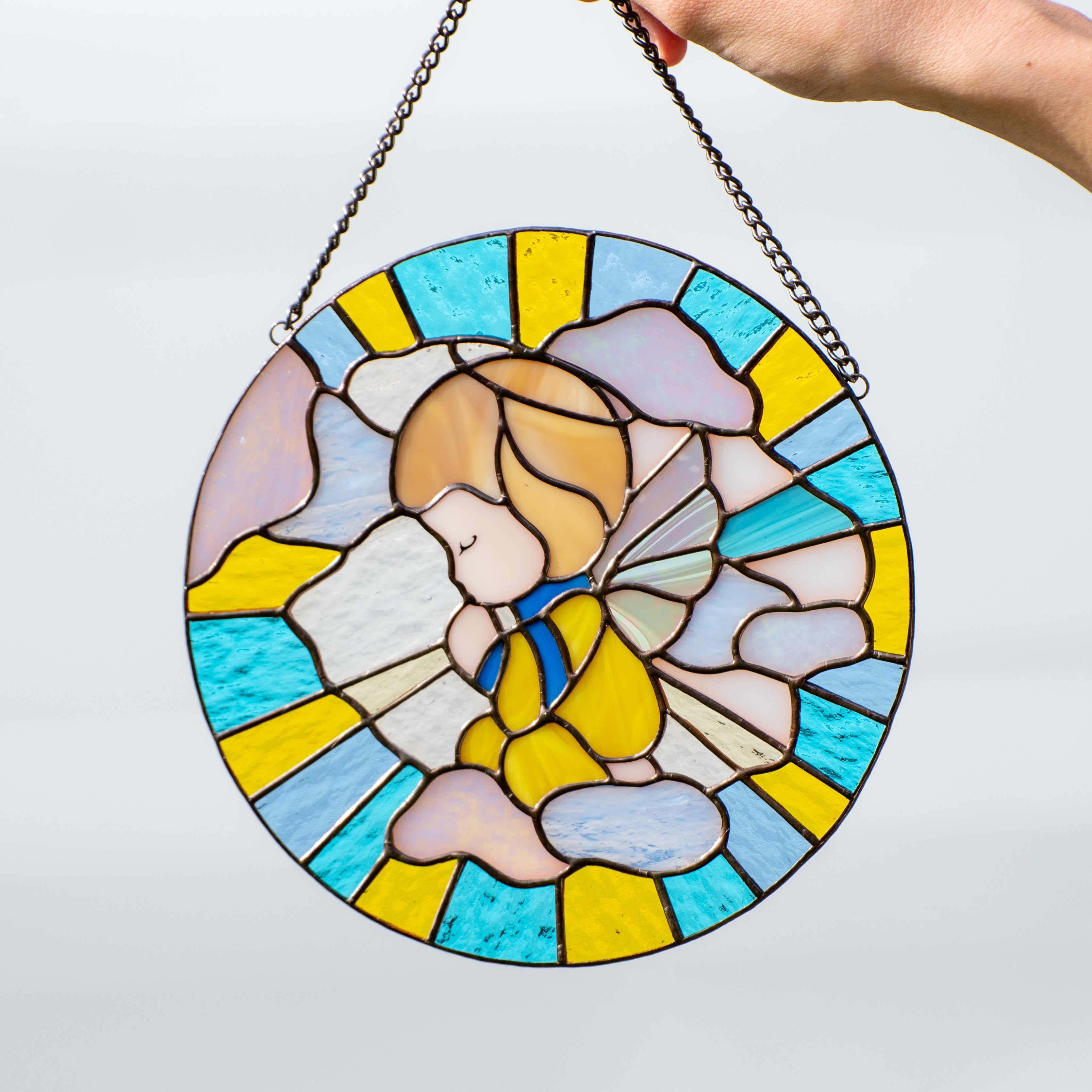 Stained glass window hanging depicting Ukrainian angel