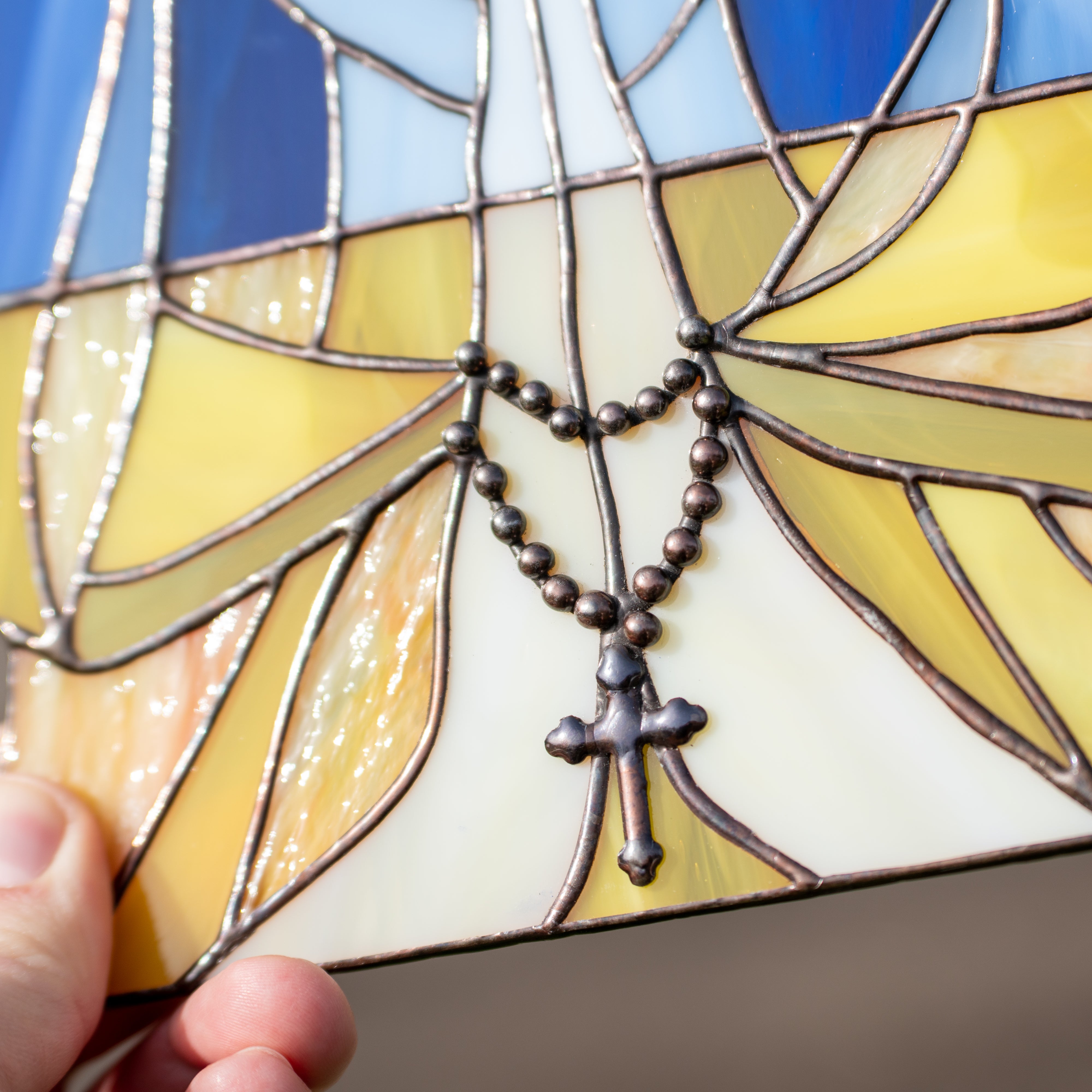 Zoomed stained glass crying Ukraine window panel