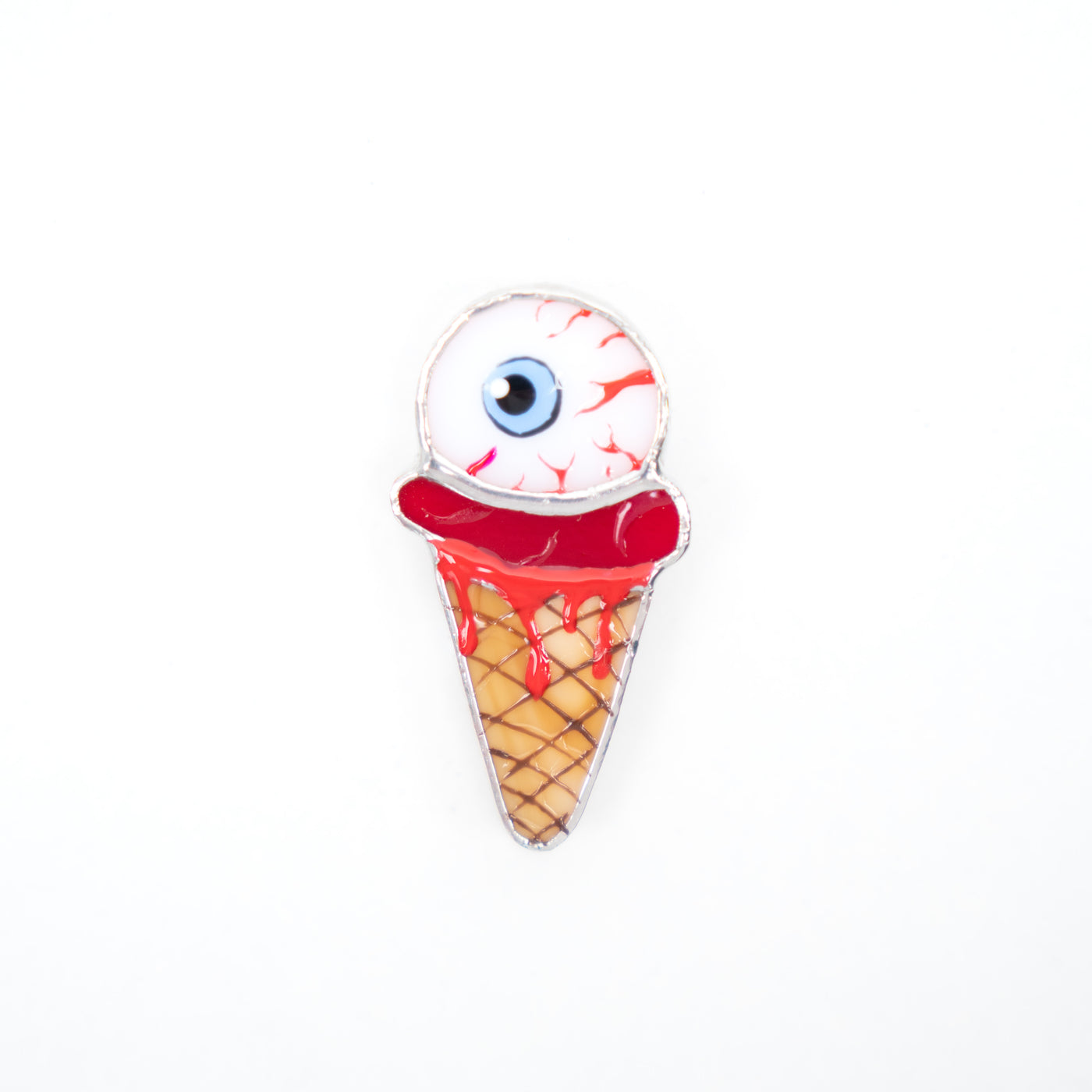 Stained glass ice-cream with the torn out eye brooch for Halloween