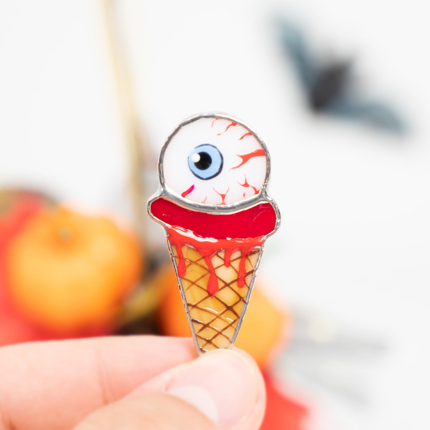 Ice-cream with the torn out eye pin of stained glass 