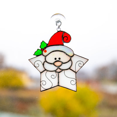 Stained glass Santa shaped as a snowflake suncatcher for Christmas window decor