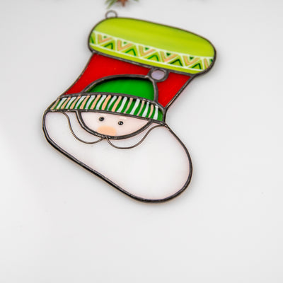 Zoomed stained glass Christmas stocking depicting Santa