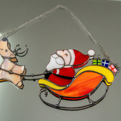 Zoomed stained glass Santa in reindeer team 