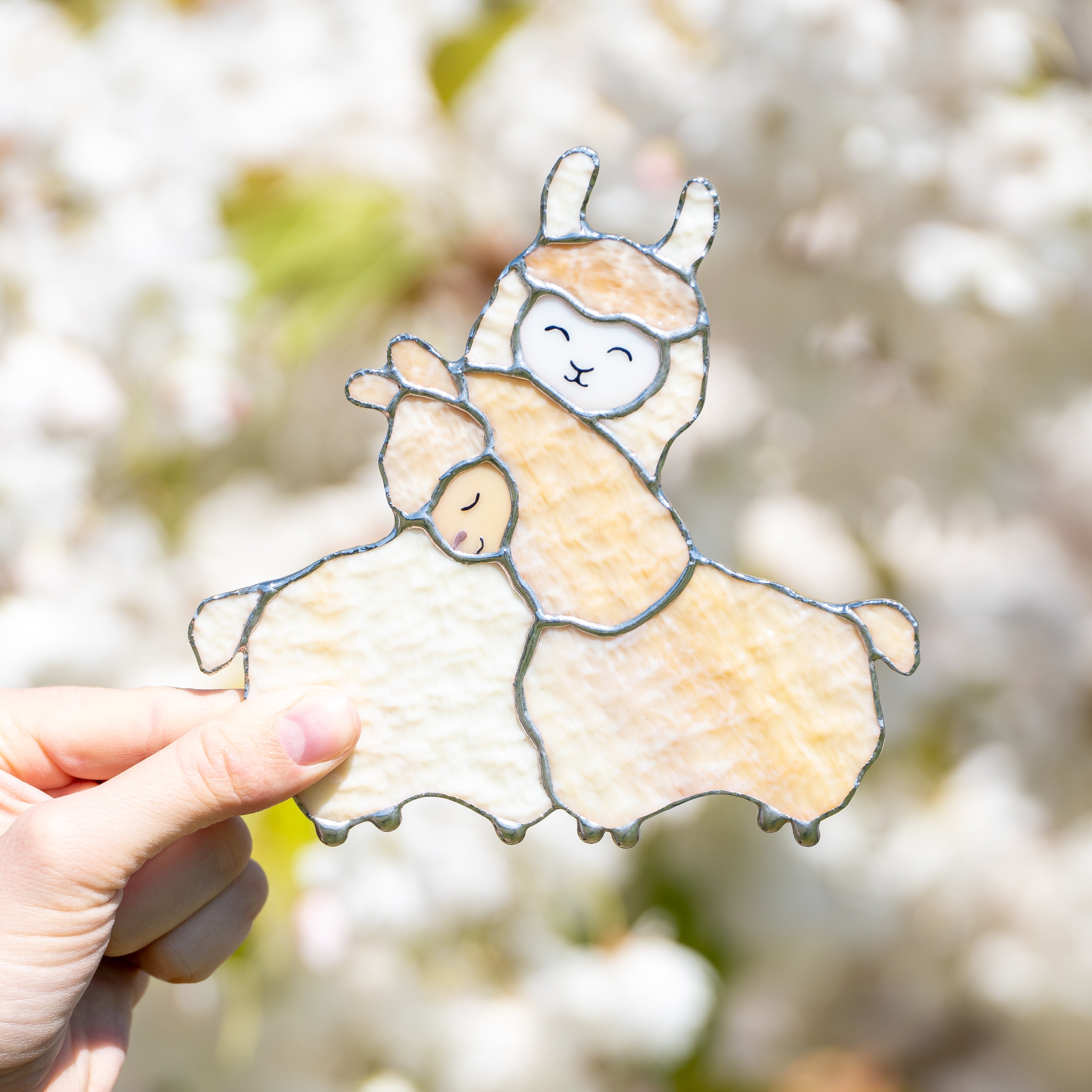 Stained glass two beige llamas cuddling suncatcher