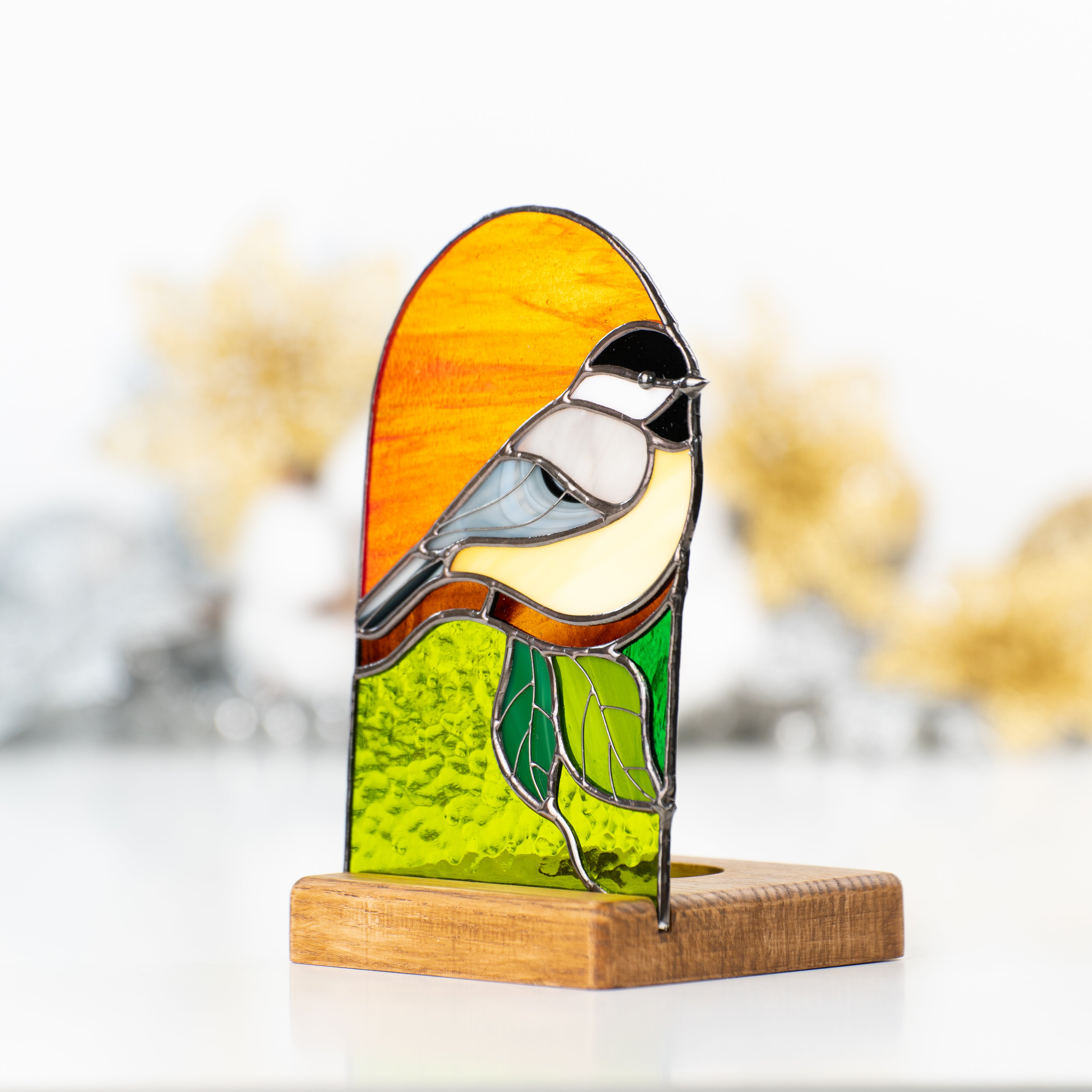 Stained glass panel depicting a chickadee