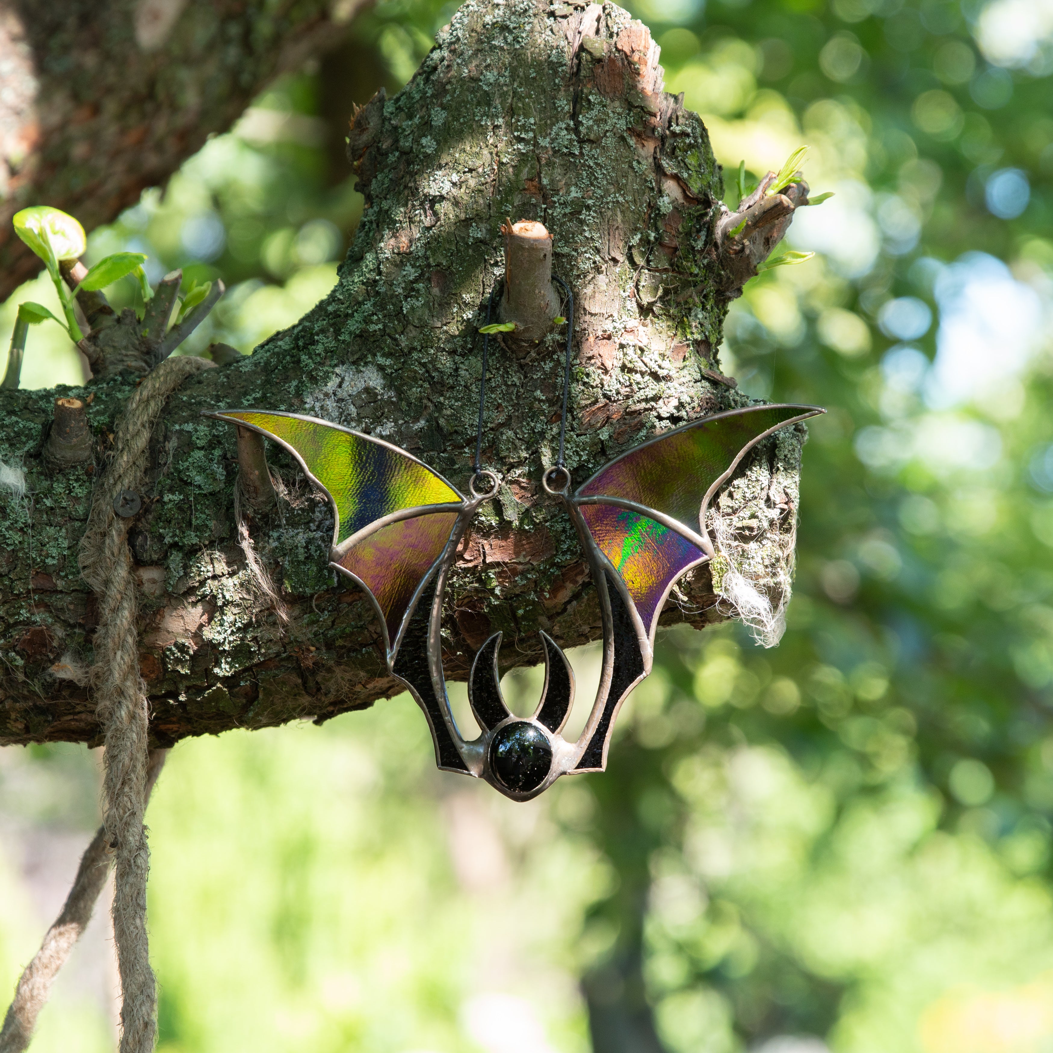 Iridescent-winged stained glass bat suncatcher for spooky Halloween decor
