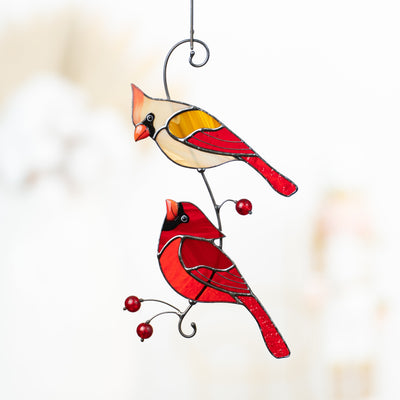 Cardinals looking at each other on the branch with berries suncatcher of stained glass