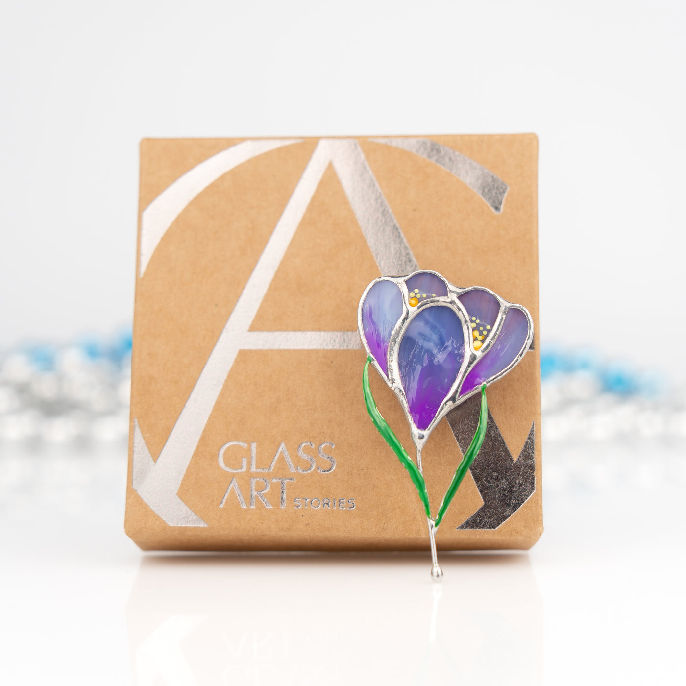 Crocus flower brooch of stained glass and a brand box
