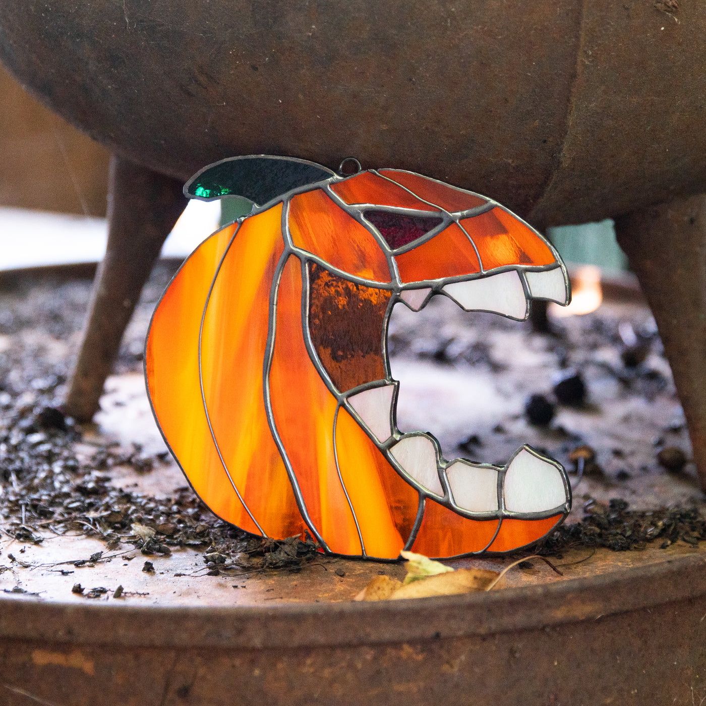 Creepy stained glass pumpkin with the fangs suncatcher