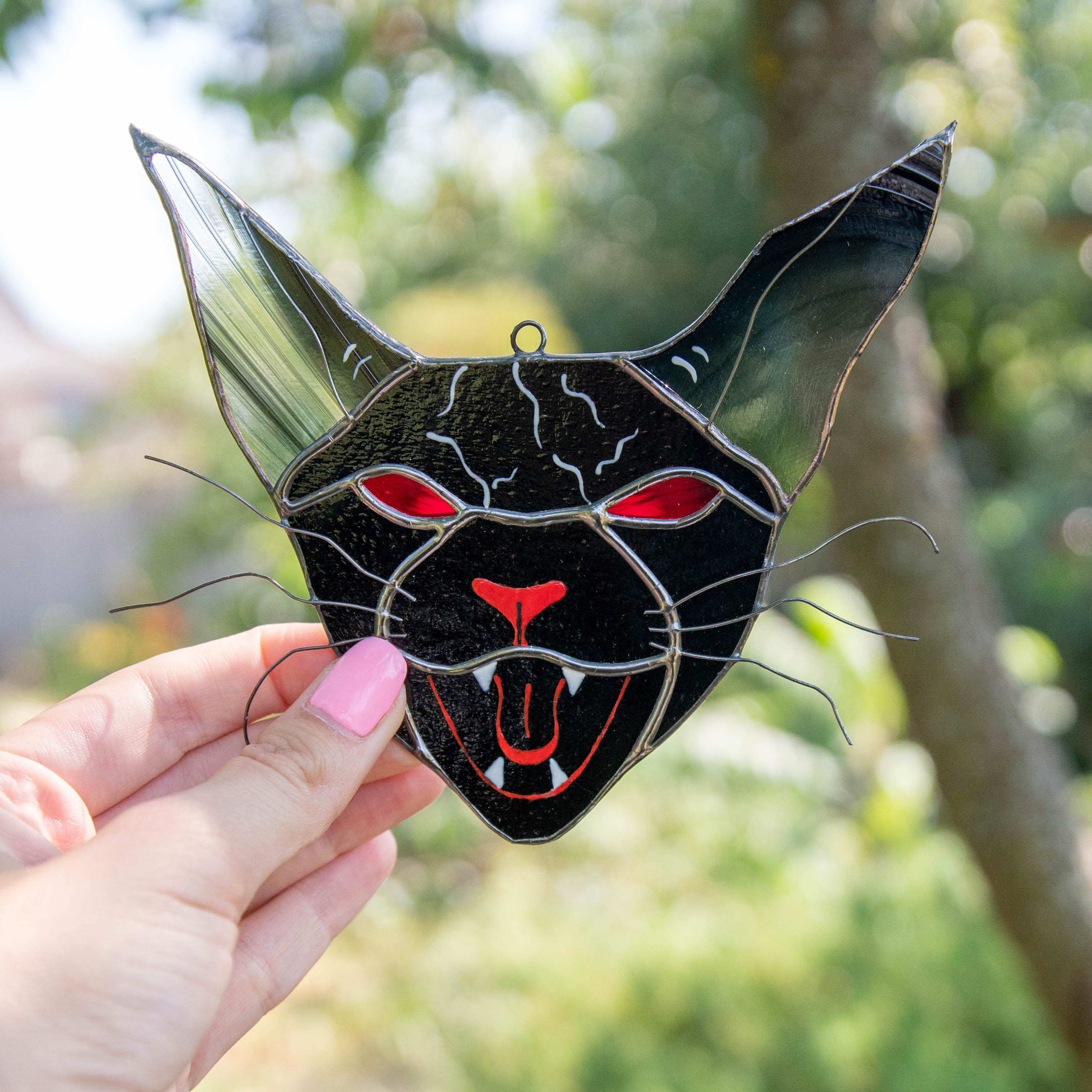 Creepy stained glass vampire cat window hanging