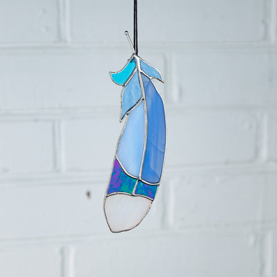 Suncatcher of stained glass bluejay feather