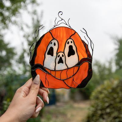 Stained glass suncatcher of ghost-eyed pumpkin for window decor
