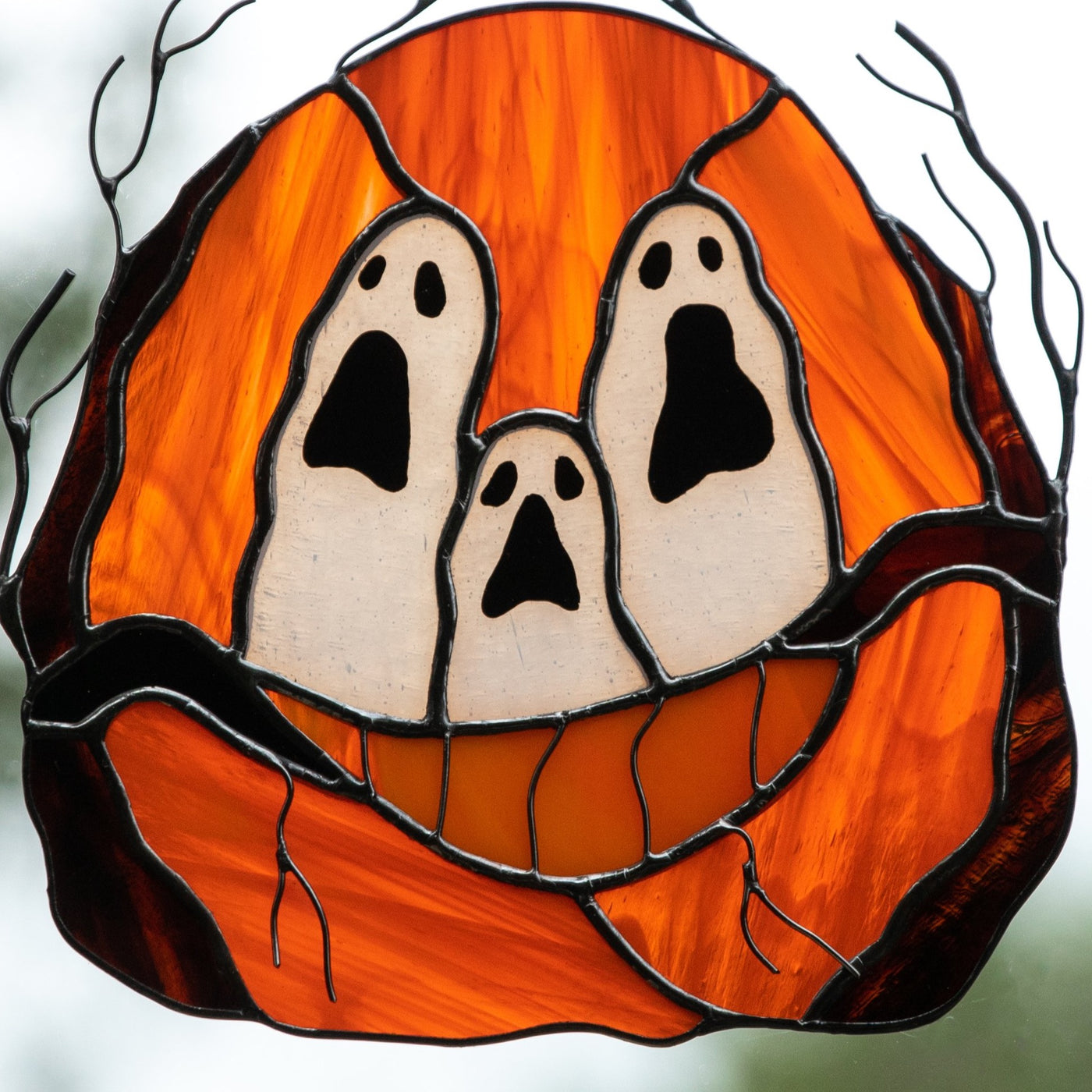 Zoomed stained glass ghost-eyed pumpkin suncatcher