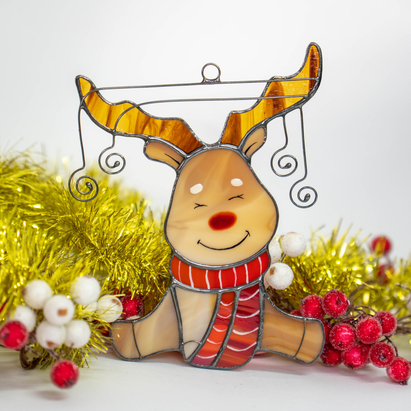 Stained glass window hanging of Rudolph reindeer in red scarf 