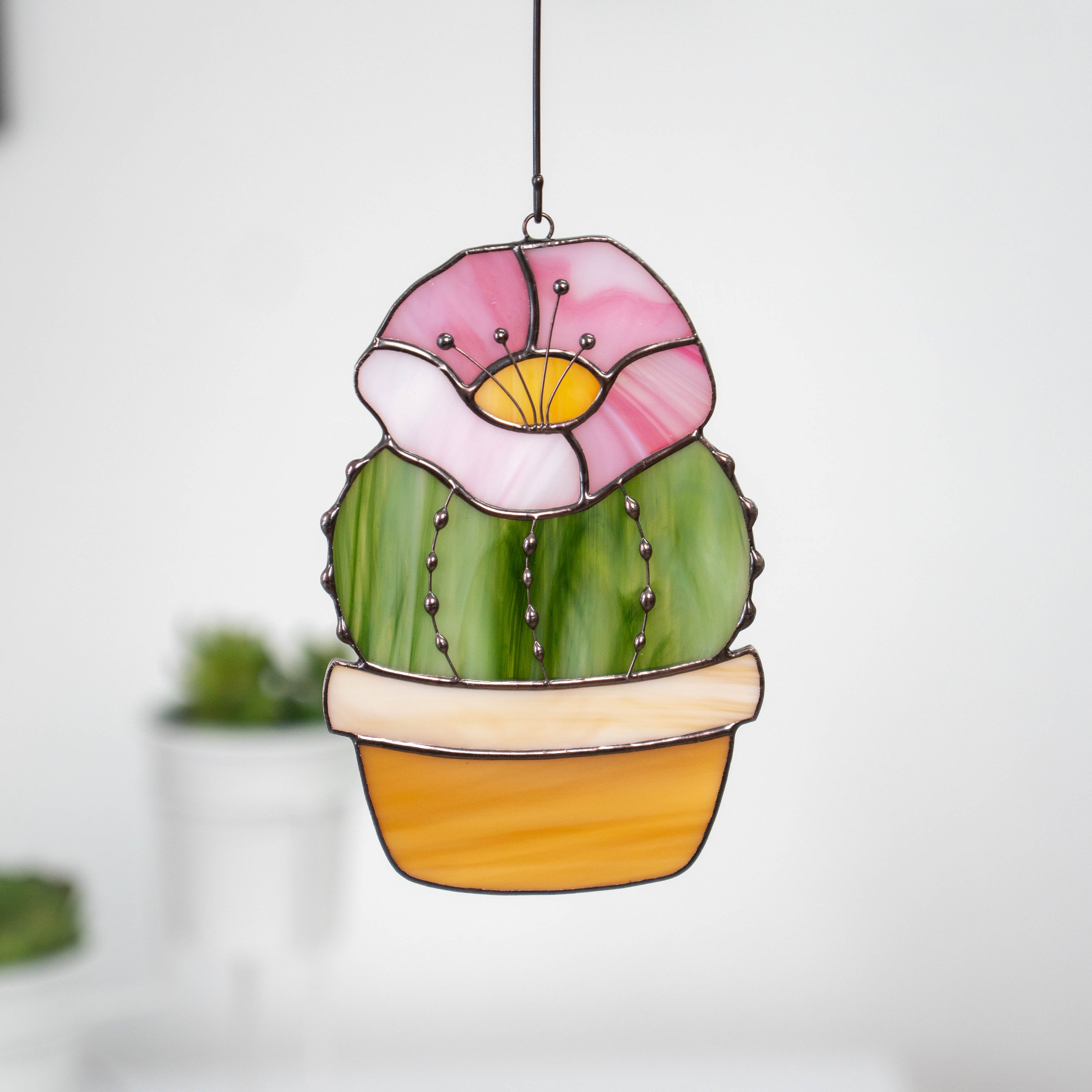 Stained glass cactus suncatcher with pink flower on top
