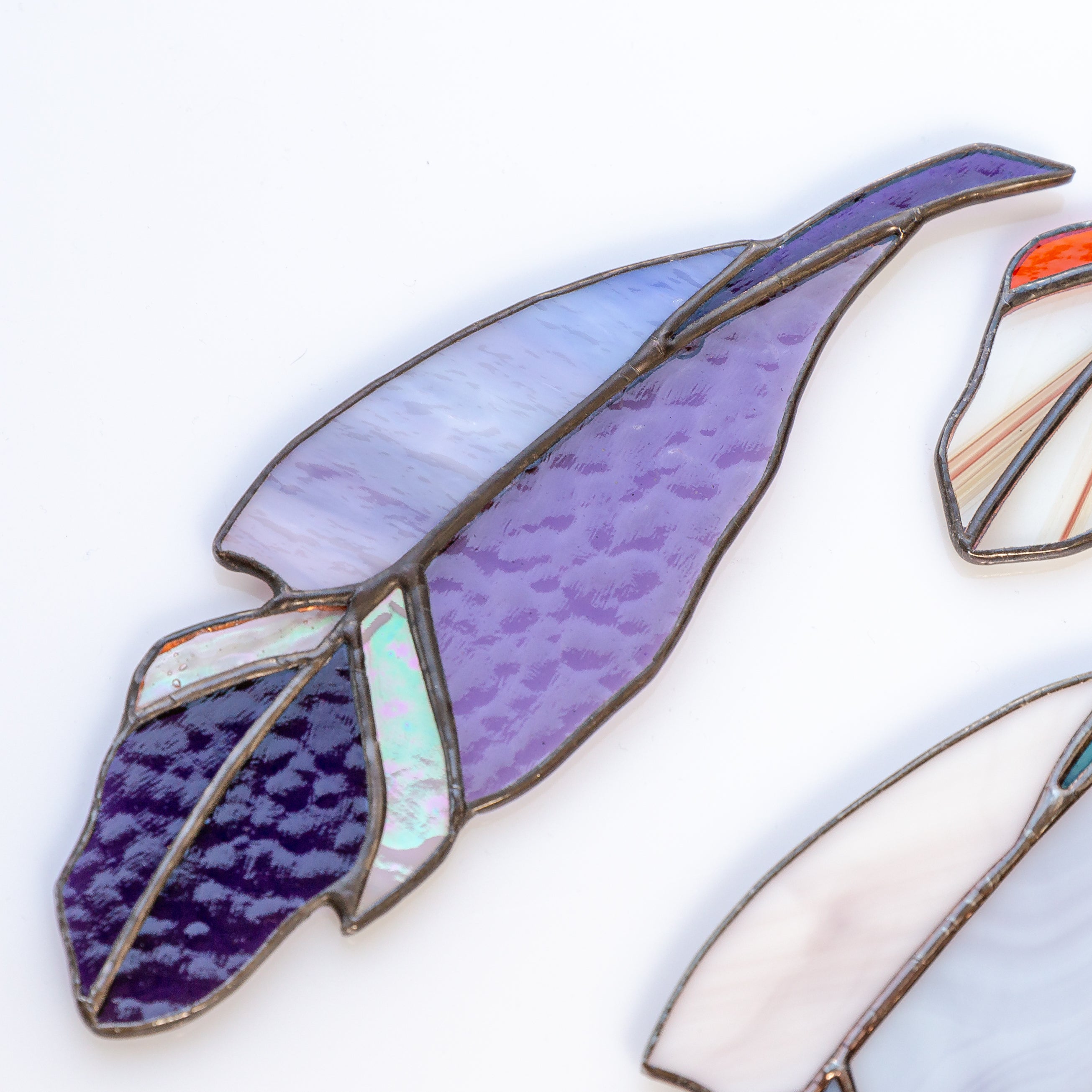 Zoomed stained glass purple window hanging