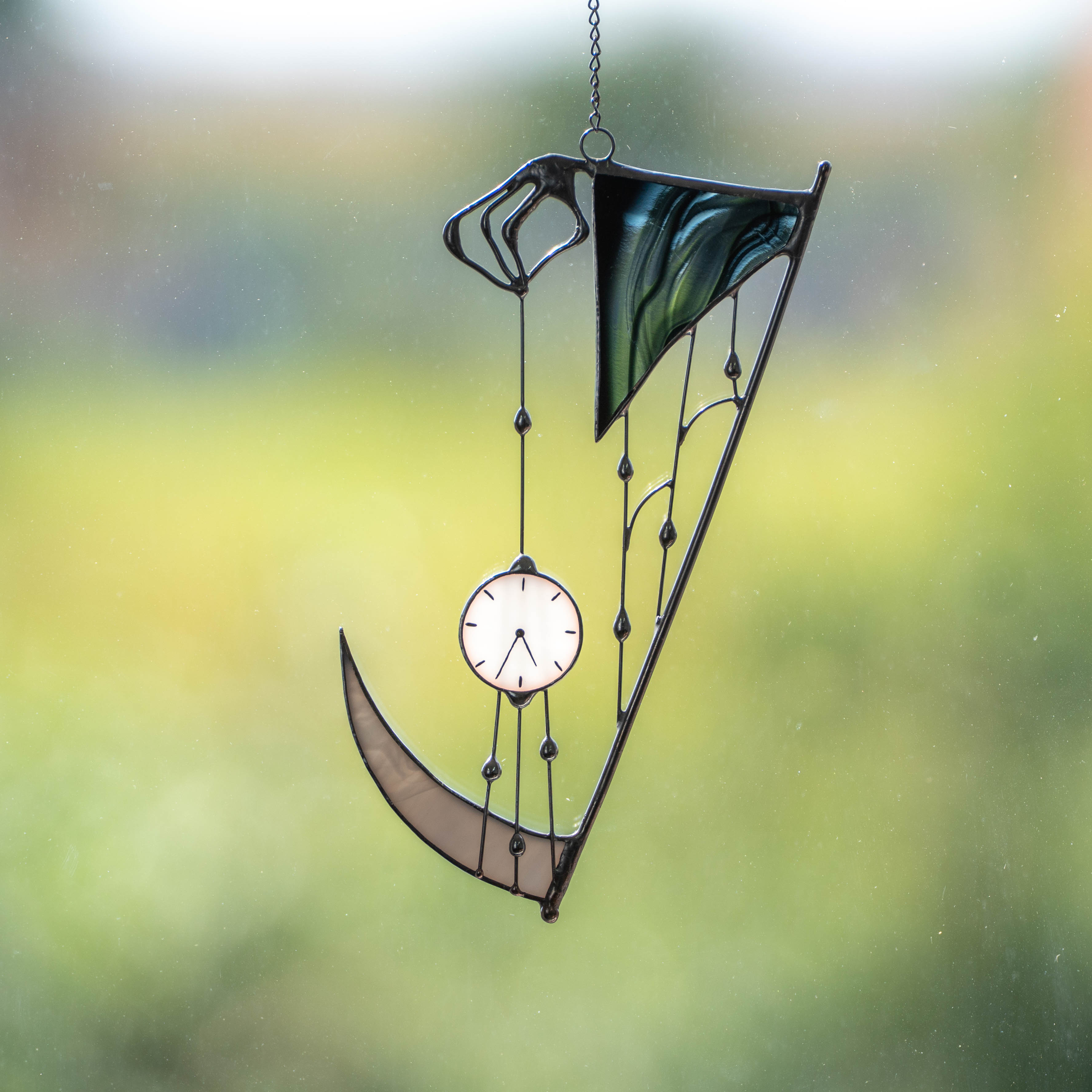 Stained glass hand of death with the clock suncatcher